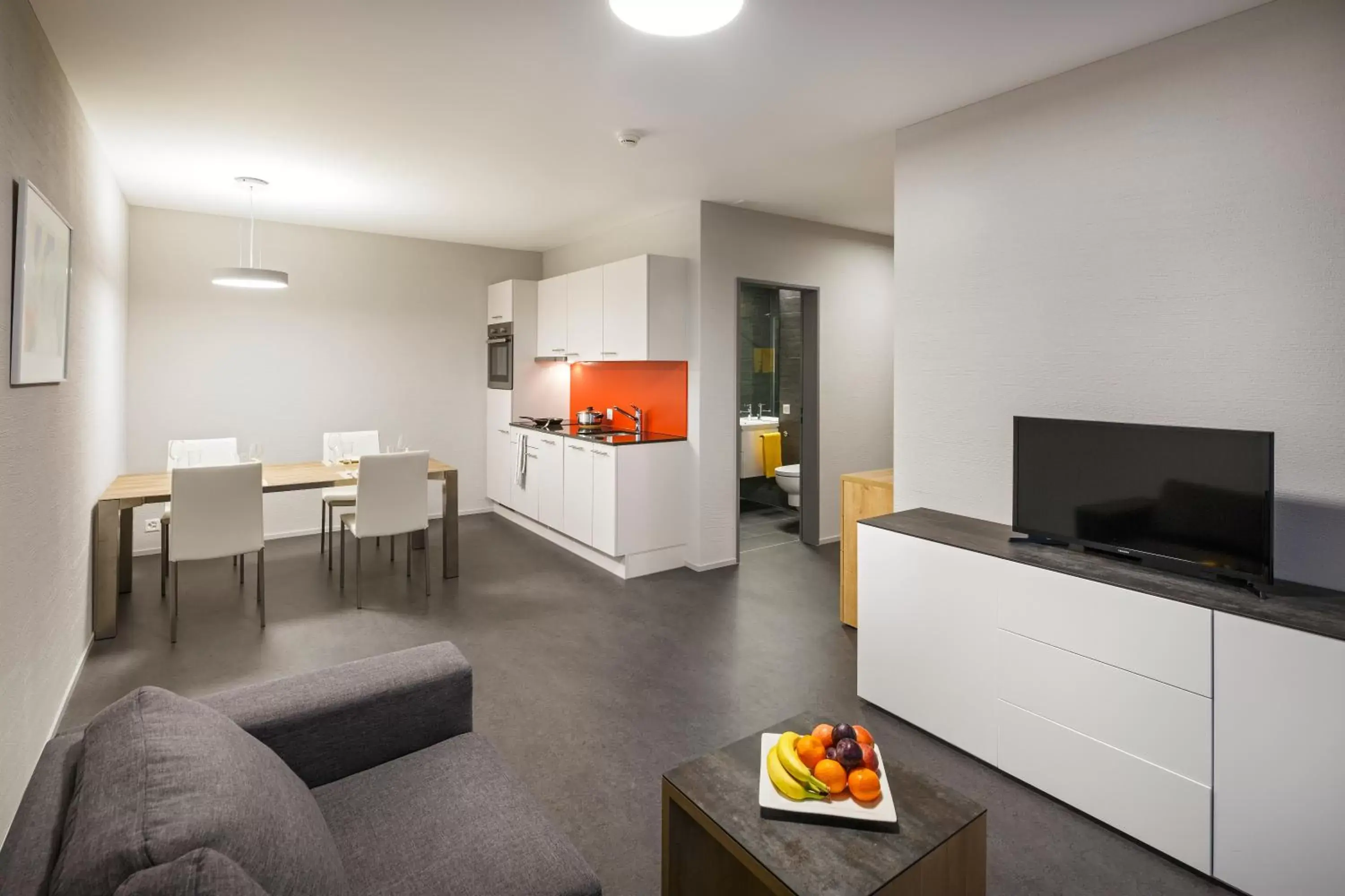 Kitchen or kitchenette, TV/Entertainment Center in Aparthotel-aarau-WEST Swiss Quality