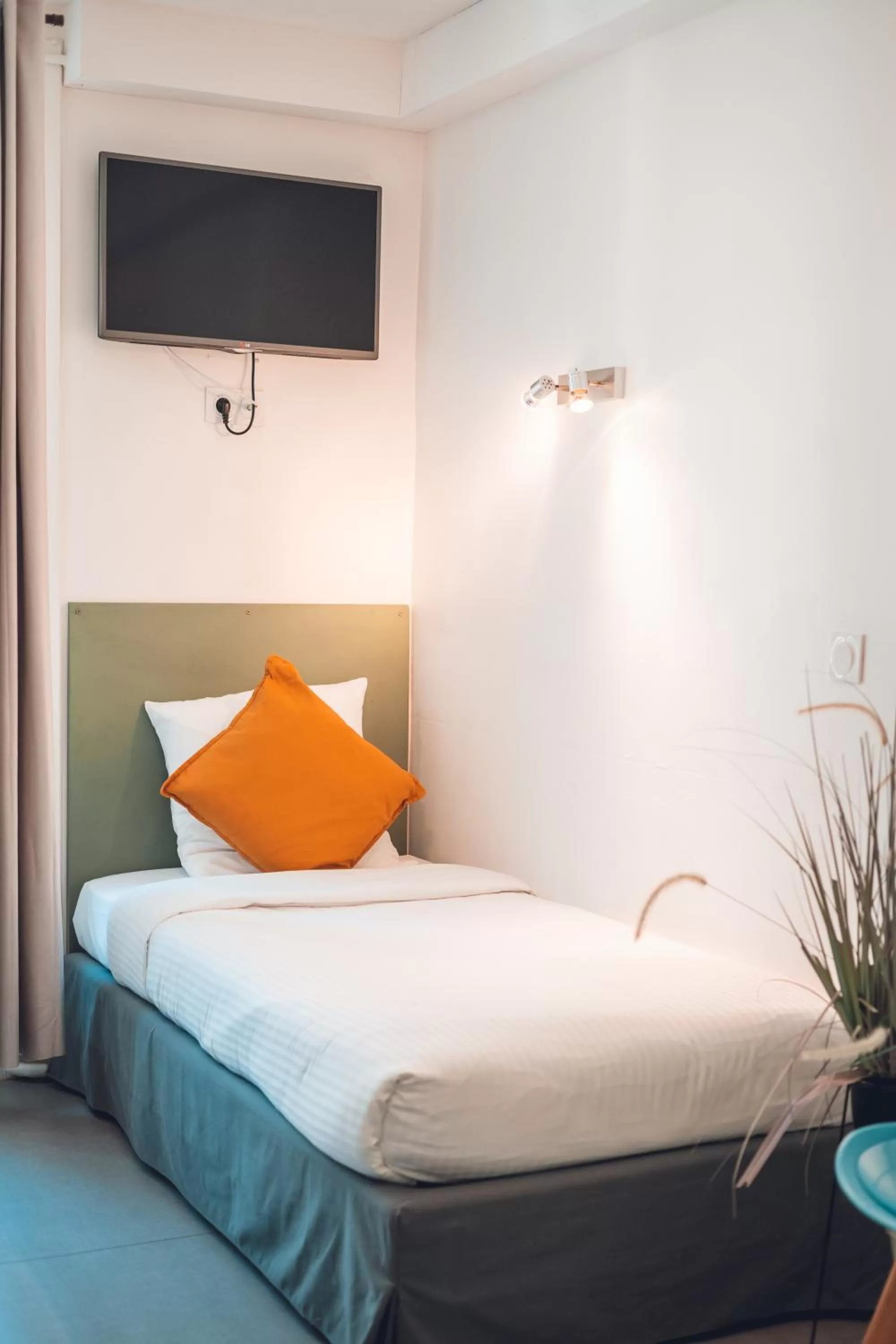 Bed in Logis Hôtel Vuillot