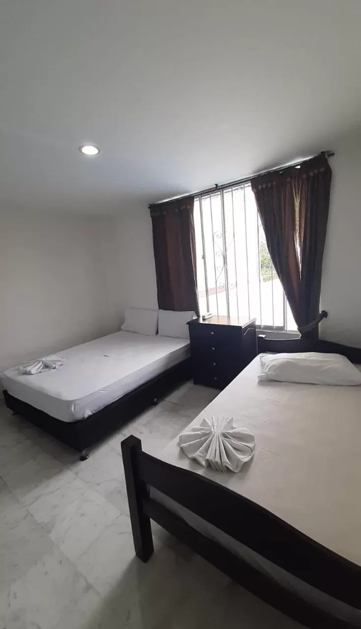 Bed in Blue Star Hotel