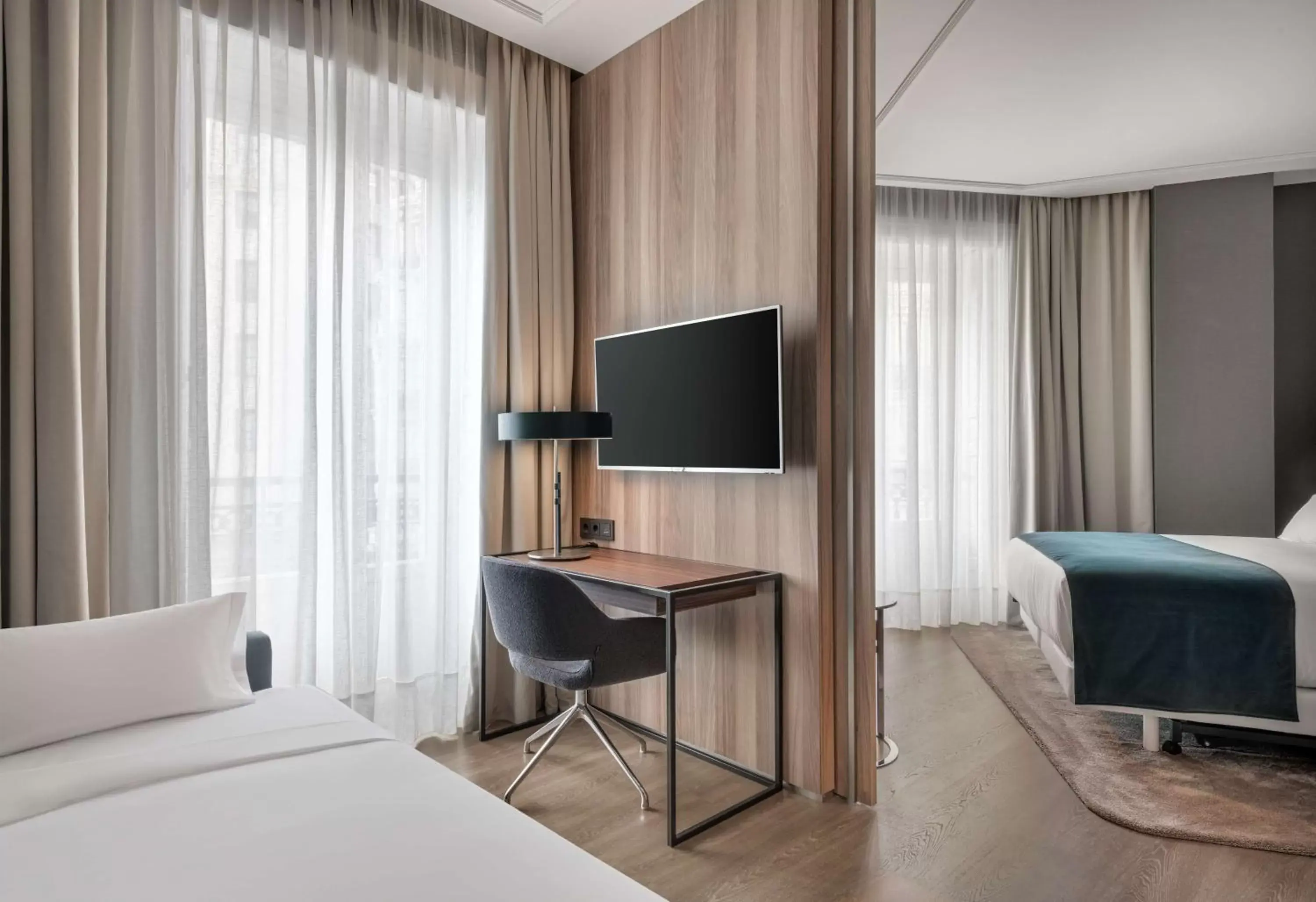 Photo of the whole room, TV/Entertainment Center in NH Collection Madrid Gran Vía
