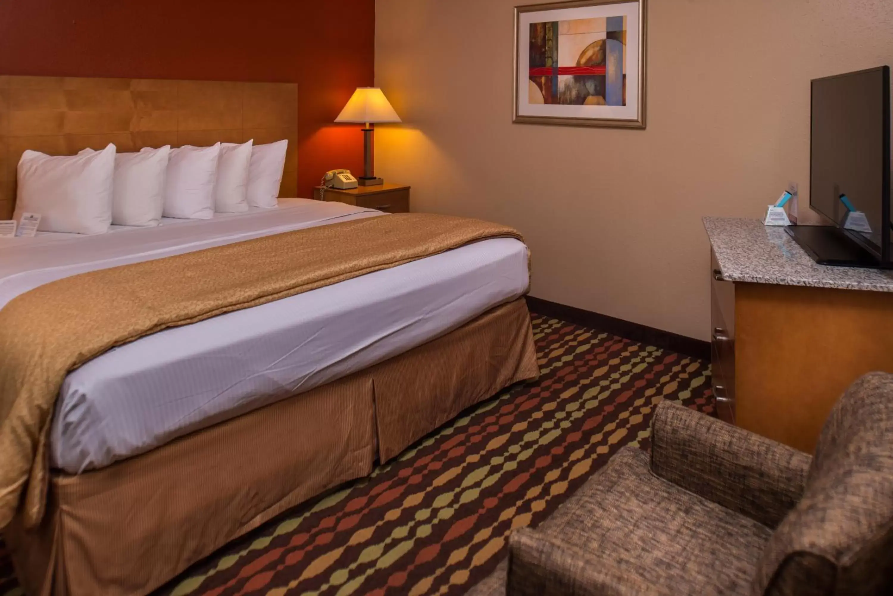 Suite with One King Bed and One Queen Bed in Best Western Ambassador Inn & Suites