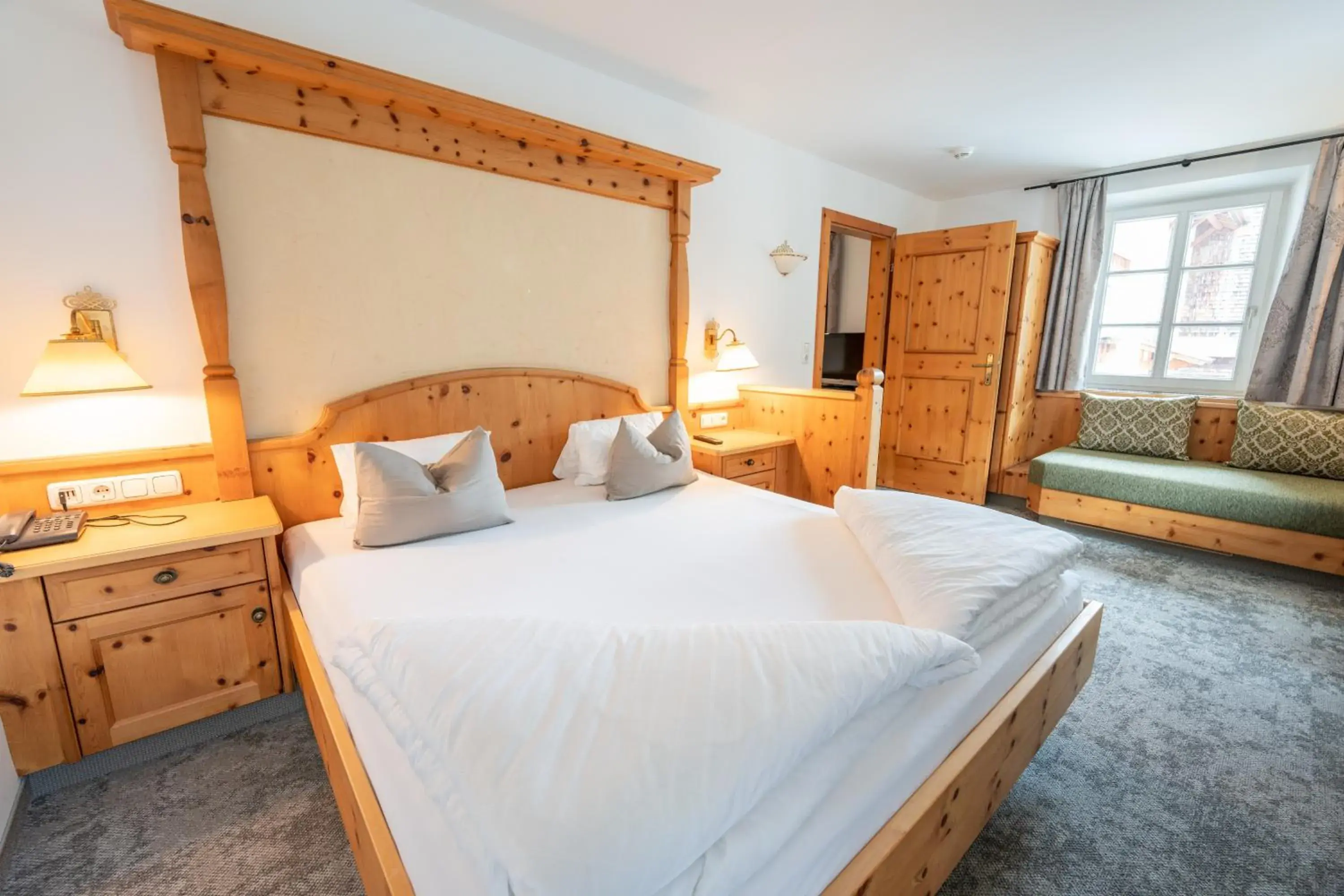 Bed in Alpenhotel Kramerwirt