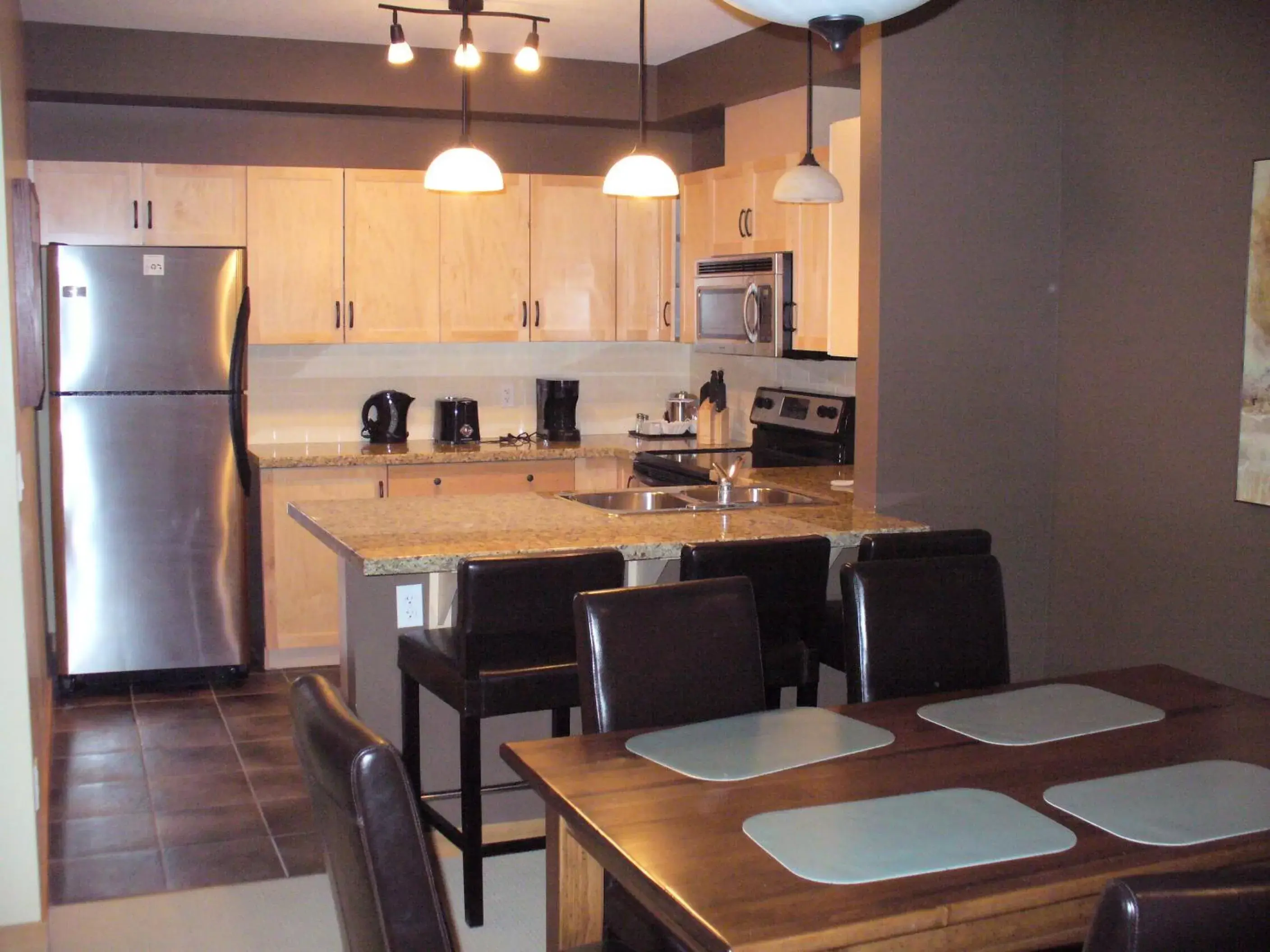 Dining area, Kitchen/Kitchenette in Lodges at Canmore