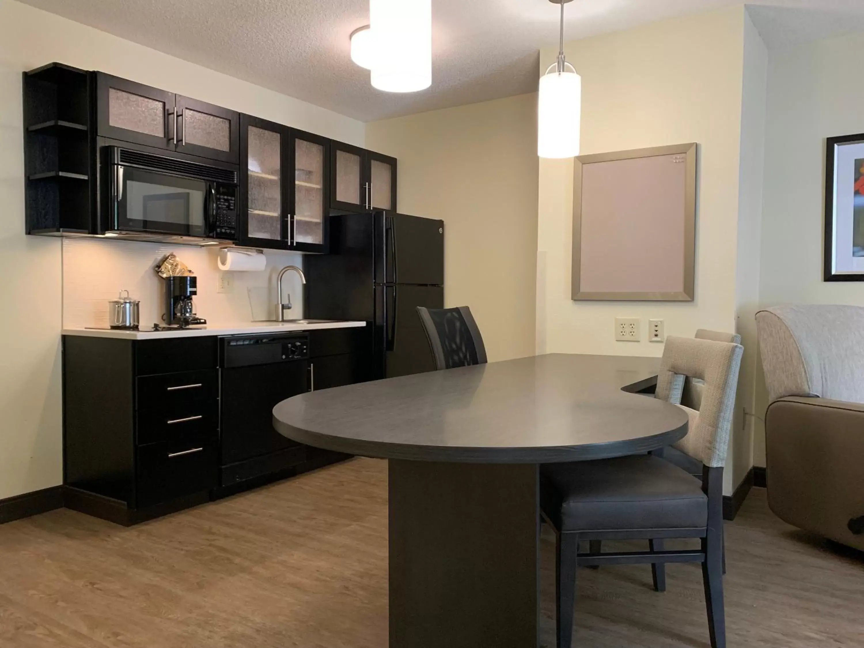 Photo of the whole room, Kitchen/Kitchenette in Candlewood Suites Raleigh Crabtree, an IHG Hotel