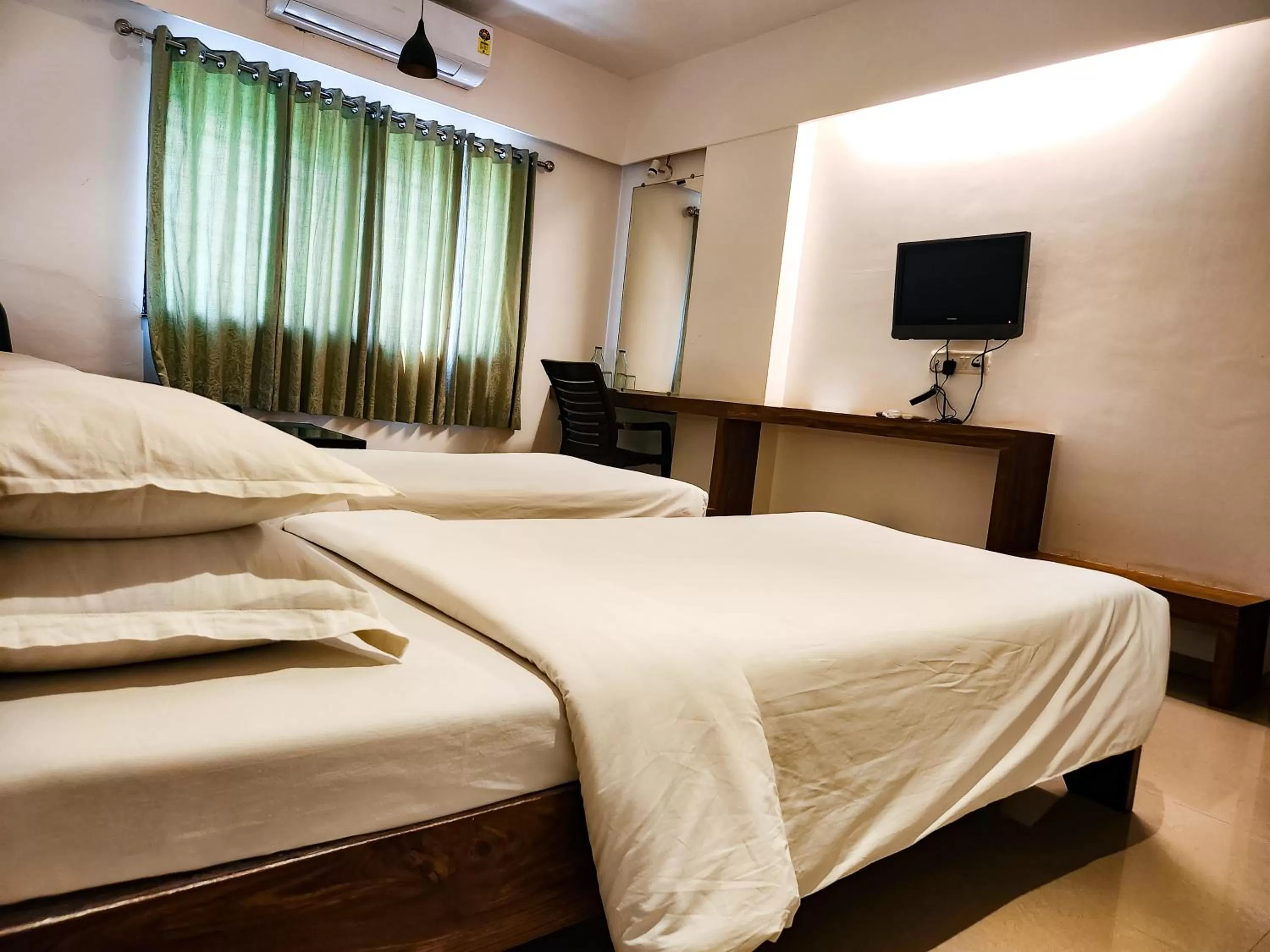 Bed in Hotel Rajwada Aurangabad