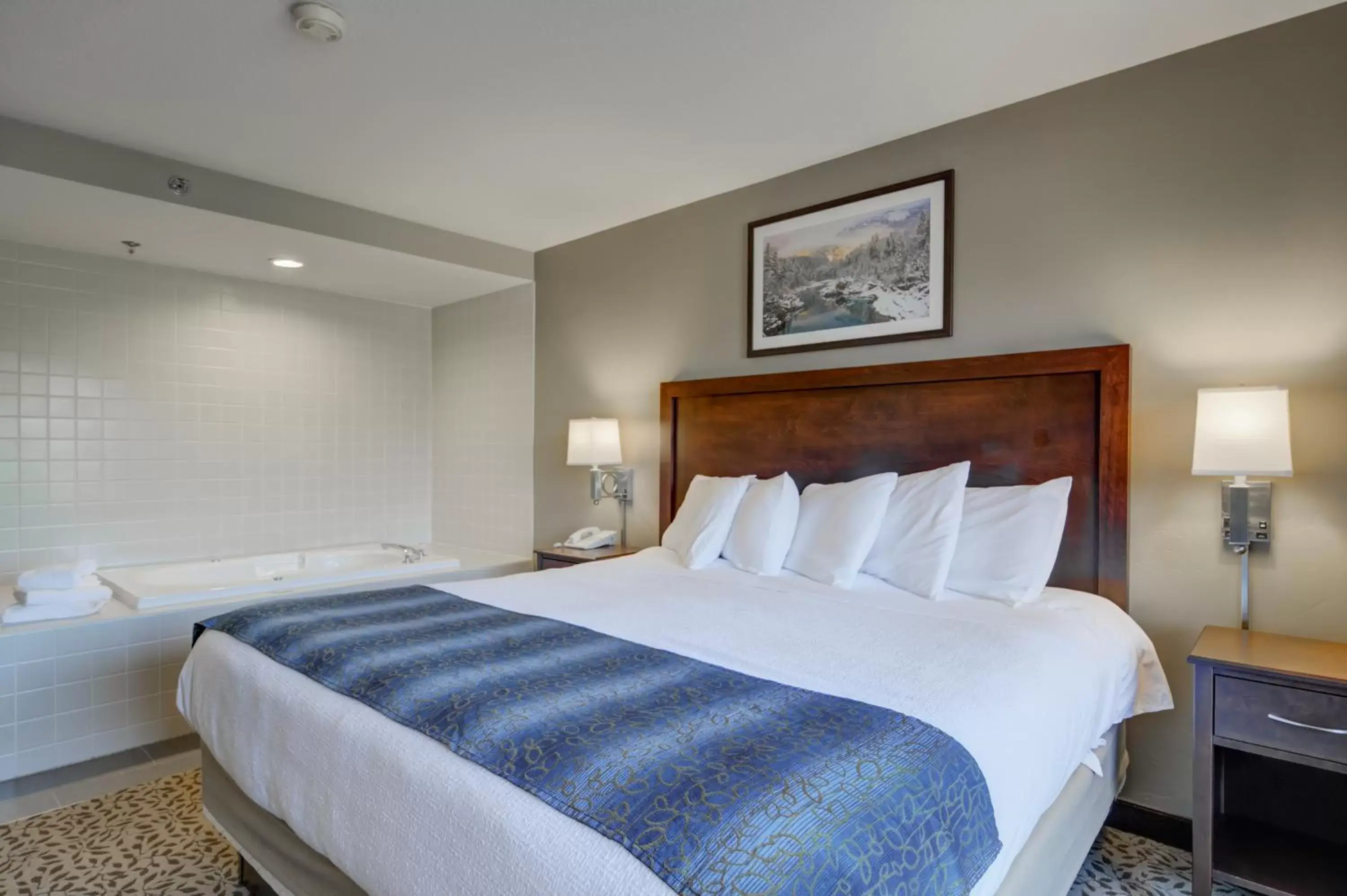 Bedroom, Bed in The Pine Lodge on Whitefish River, Ascend Hotel Collection