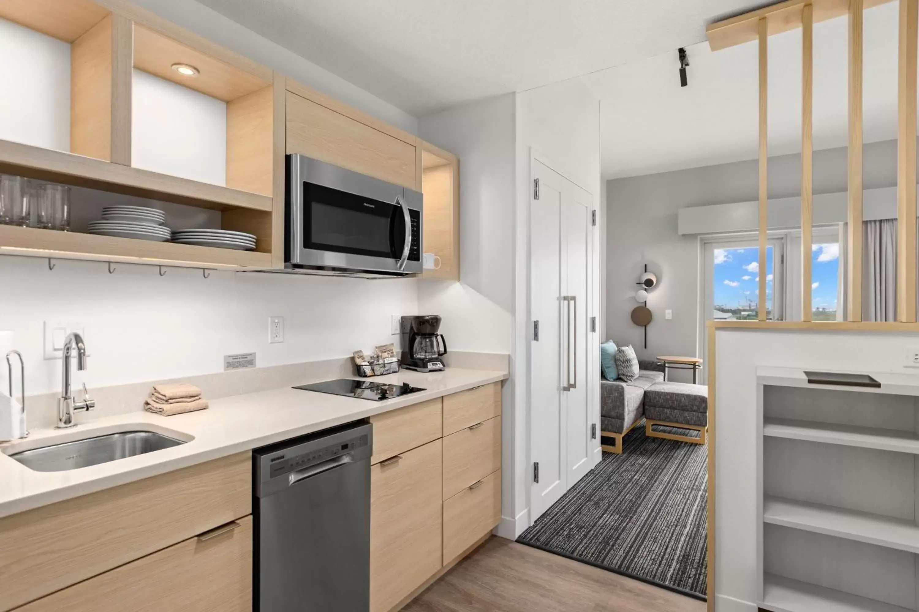 Bedroom, Kitchen/Kitchenette in TownePlace Suites by Marriott Cape Canaveral Cocoa Beach
