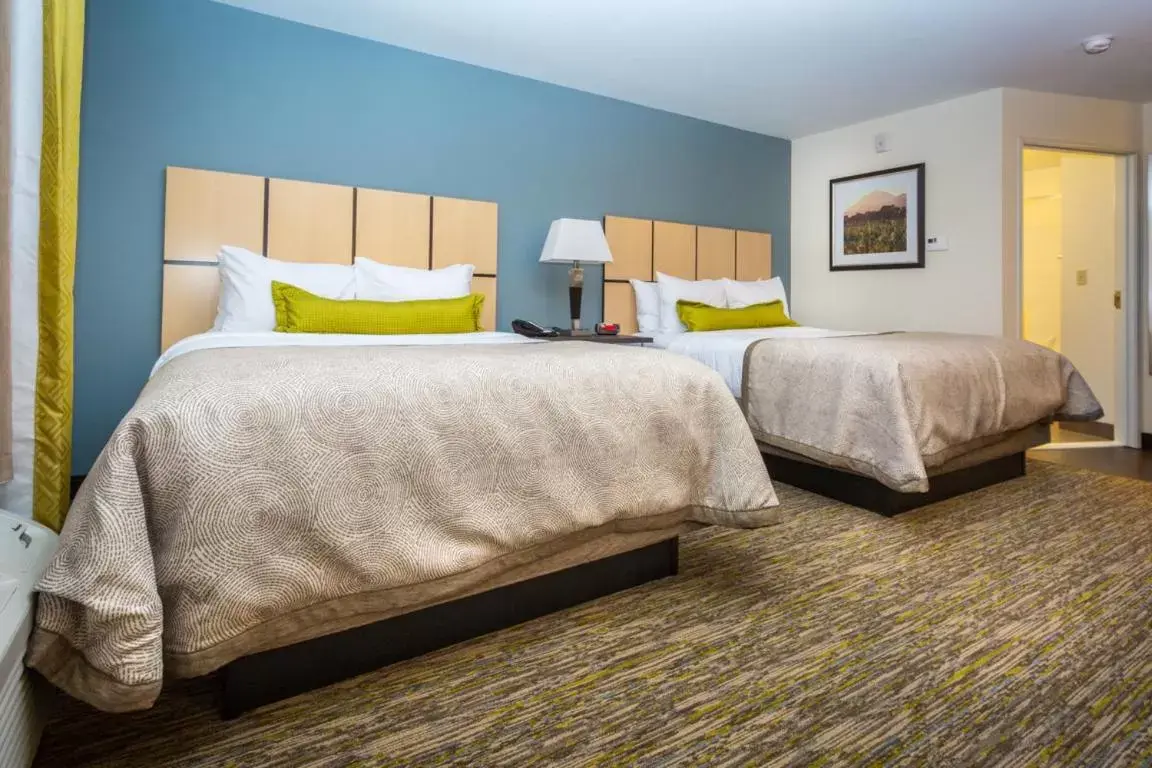 Bed in Candlewood Suites Sidney, an IHG Hotel