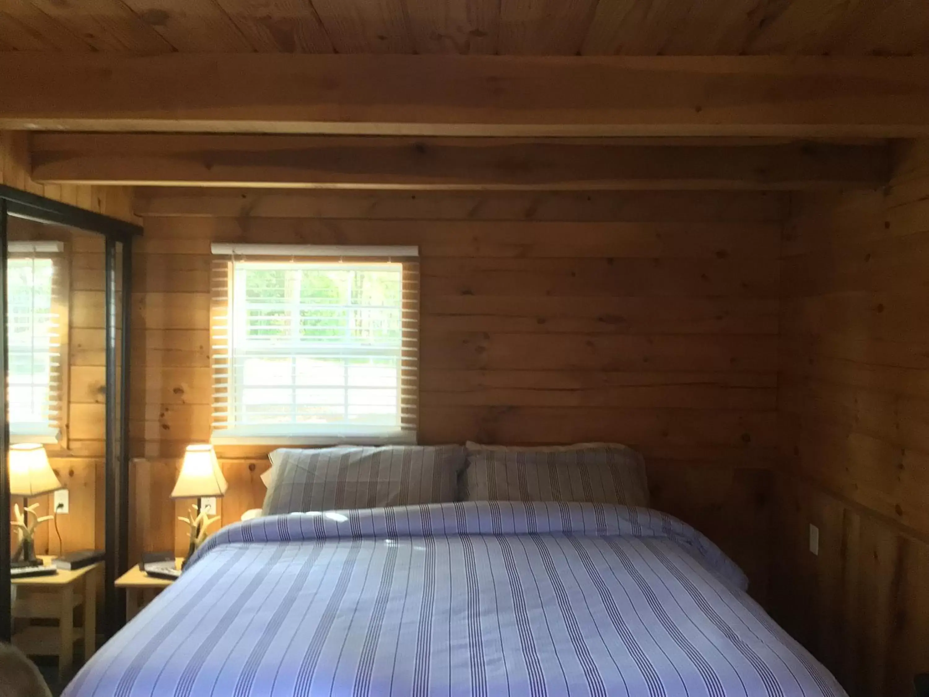 Bed in Kozy Haven Log Cabin Rentals