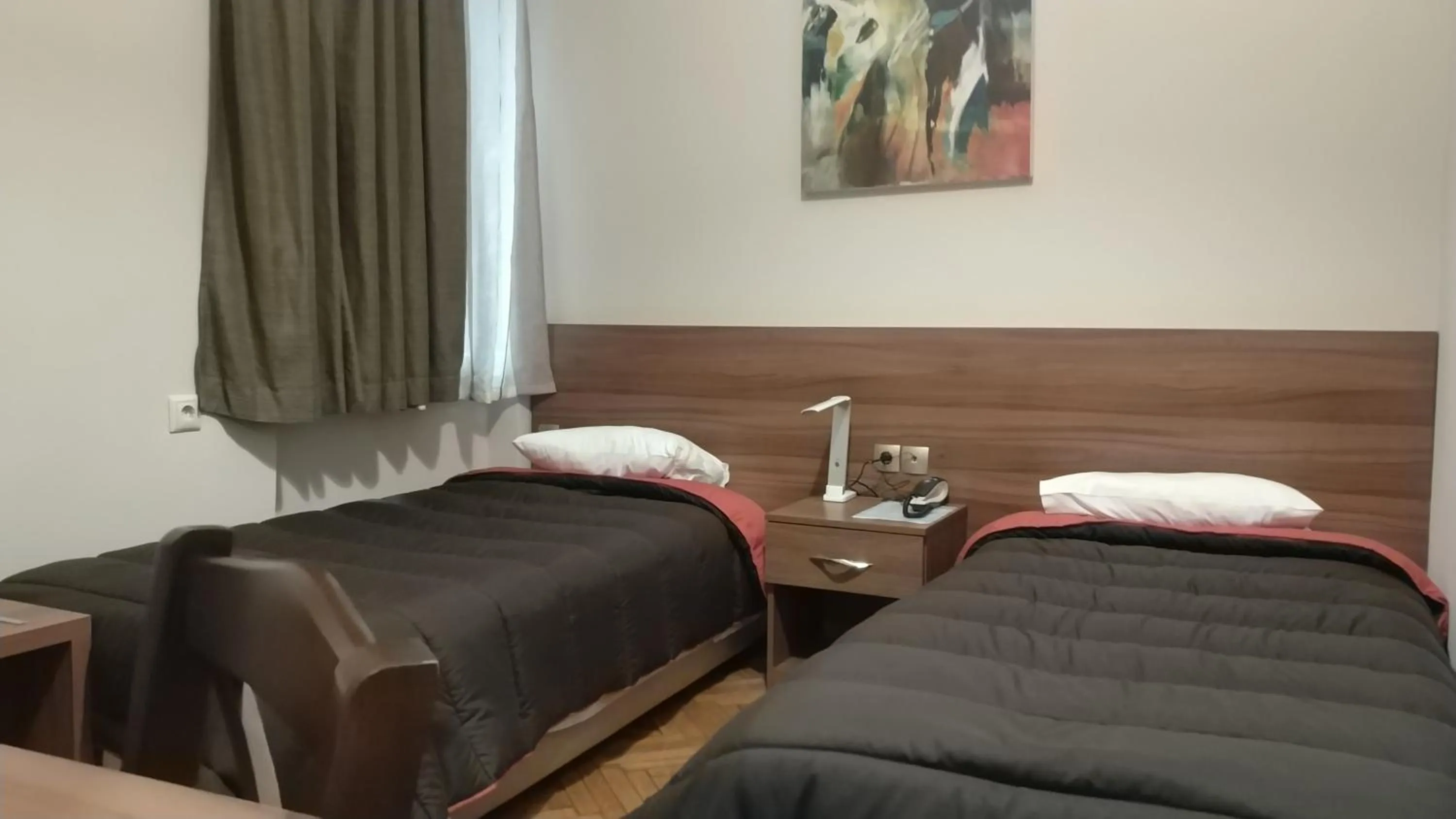 Bed in Ambrosia Suites