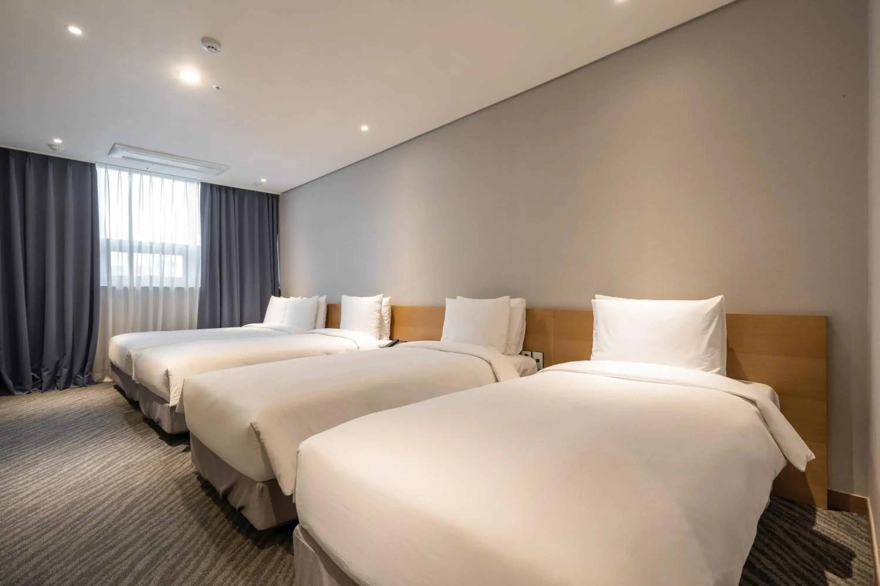 Bed in Ramada by Wyndham Seoul Dongdaemun