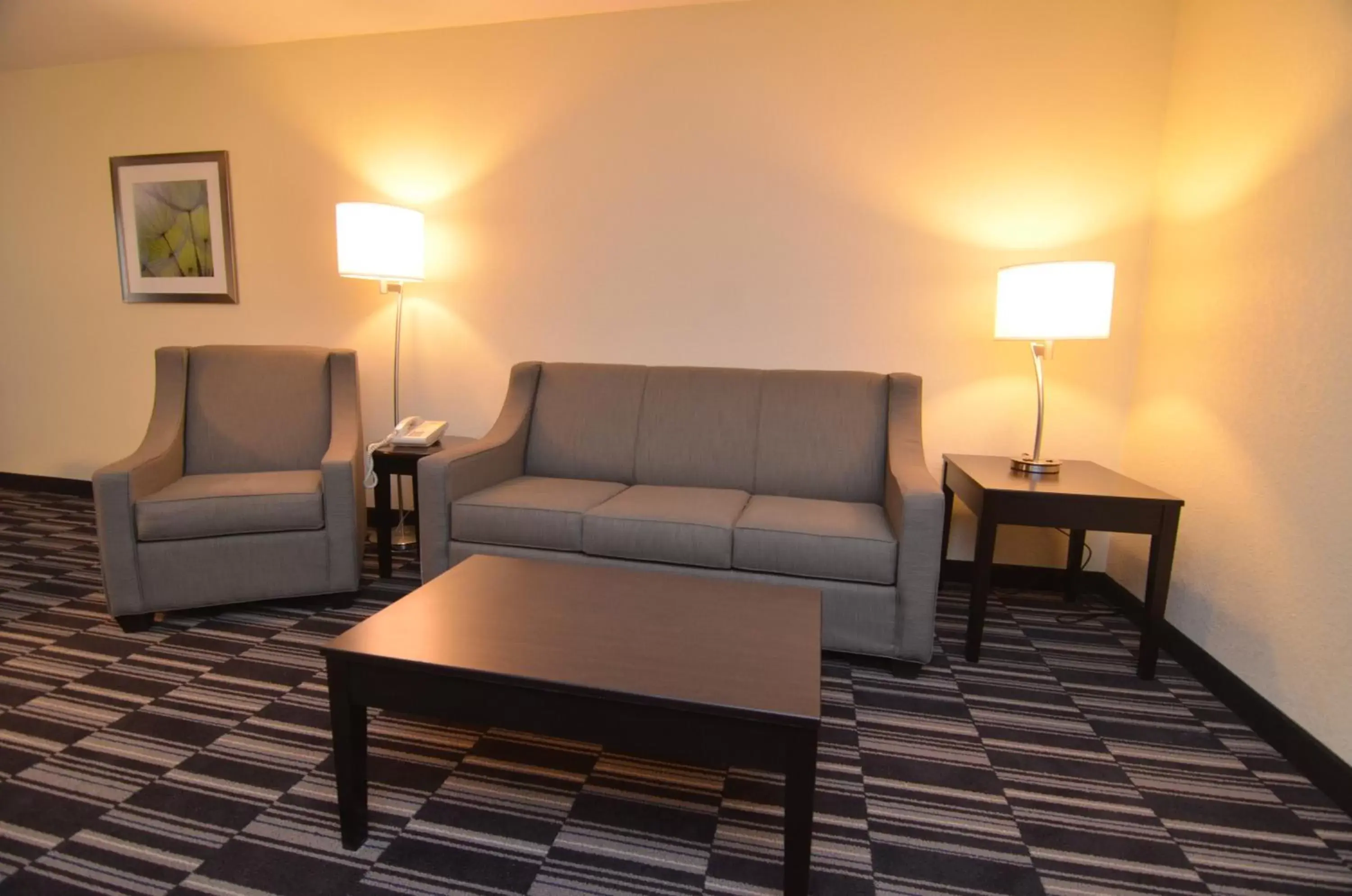 Living room, Seating Area in AmericInn by Wyndham Mount Pleasant