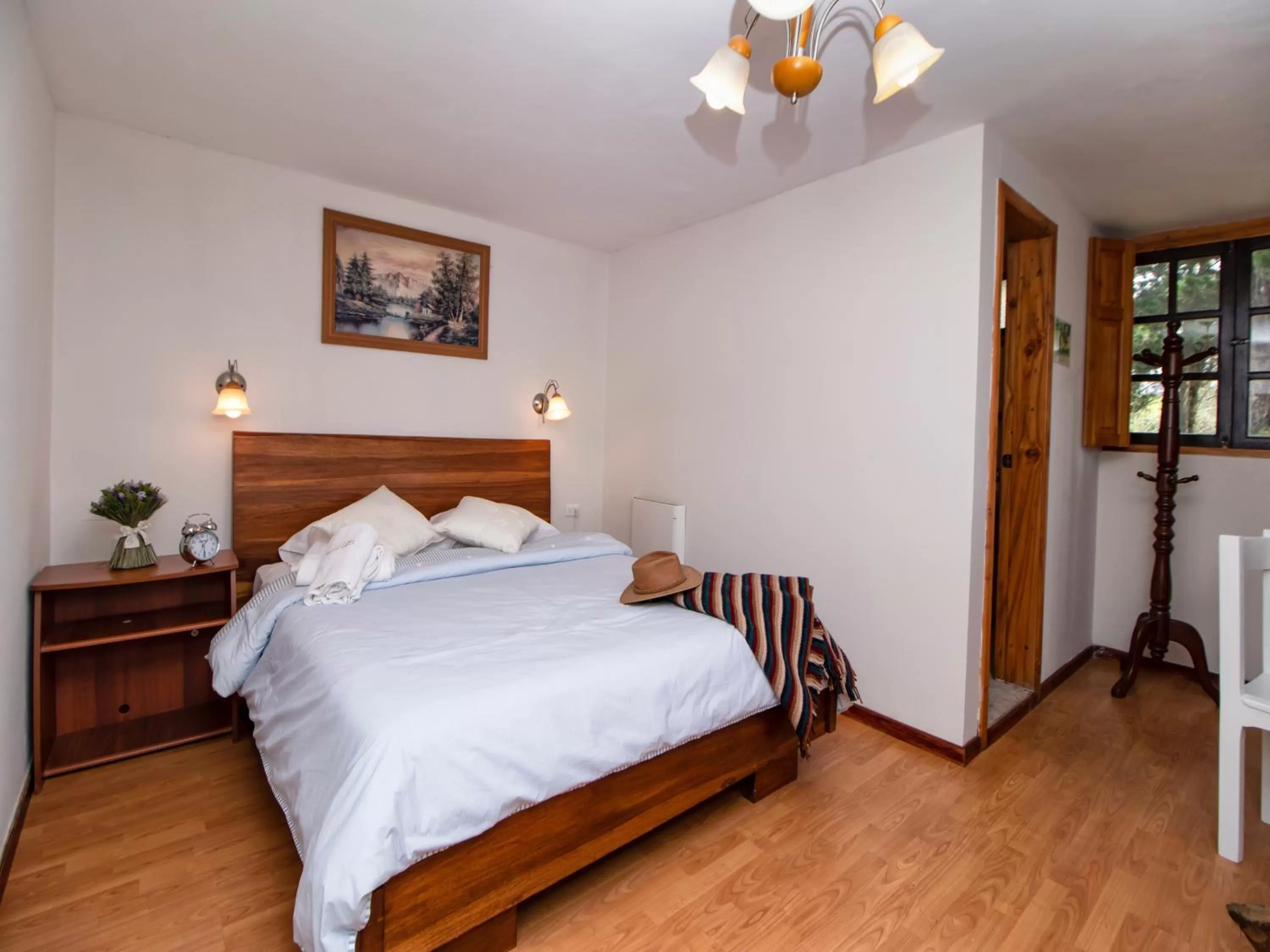 Bed in Hosteria Papagayo Cotopaxi