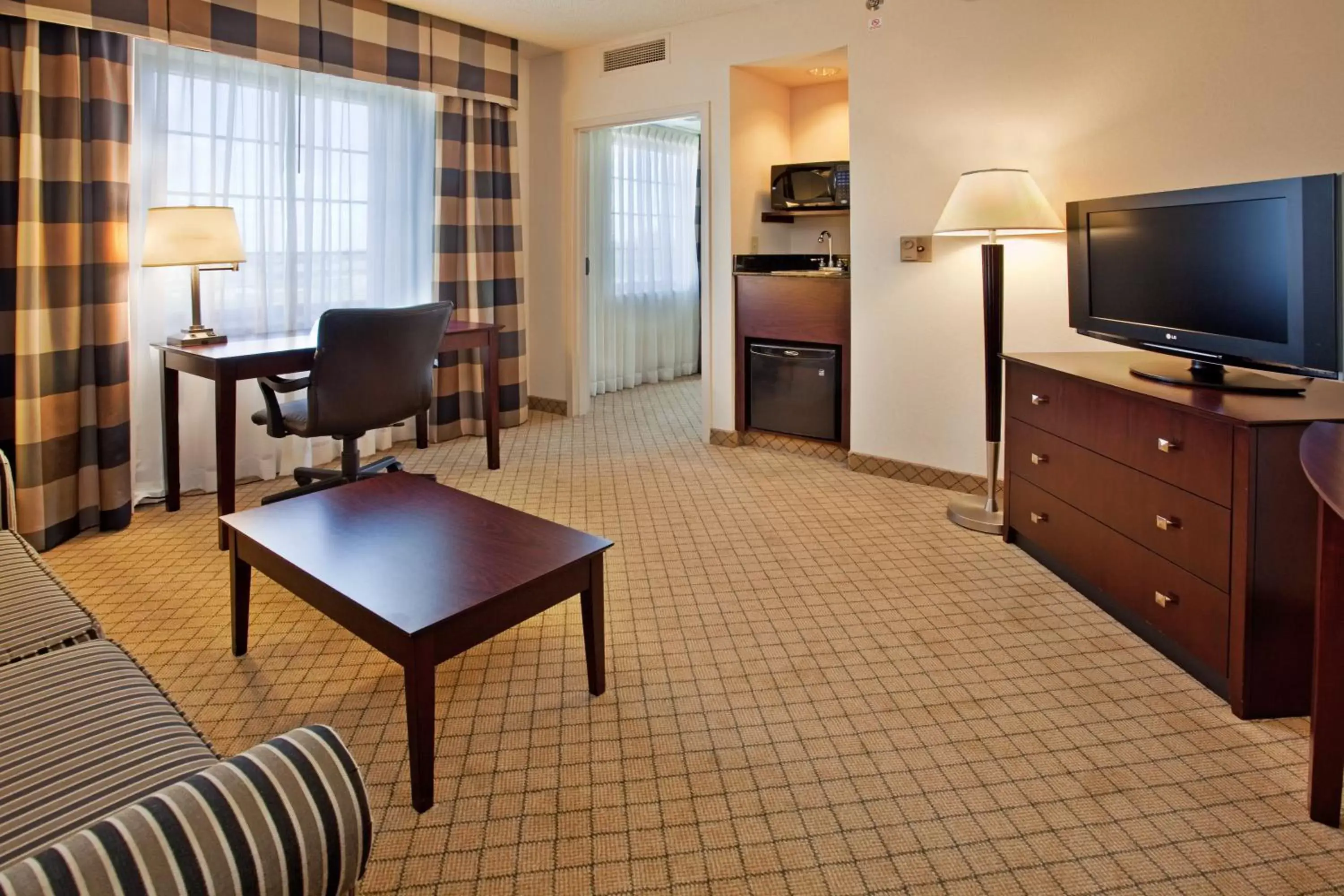 Photo of the whole room, TV/Entertainment Center in Holiday Inn Hotel & Suites Springfield, an IHG Hotel