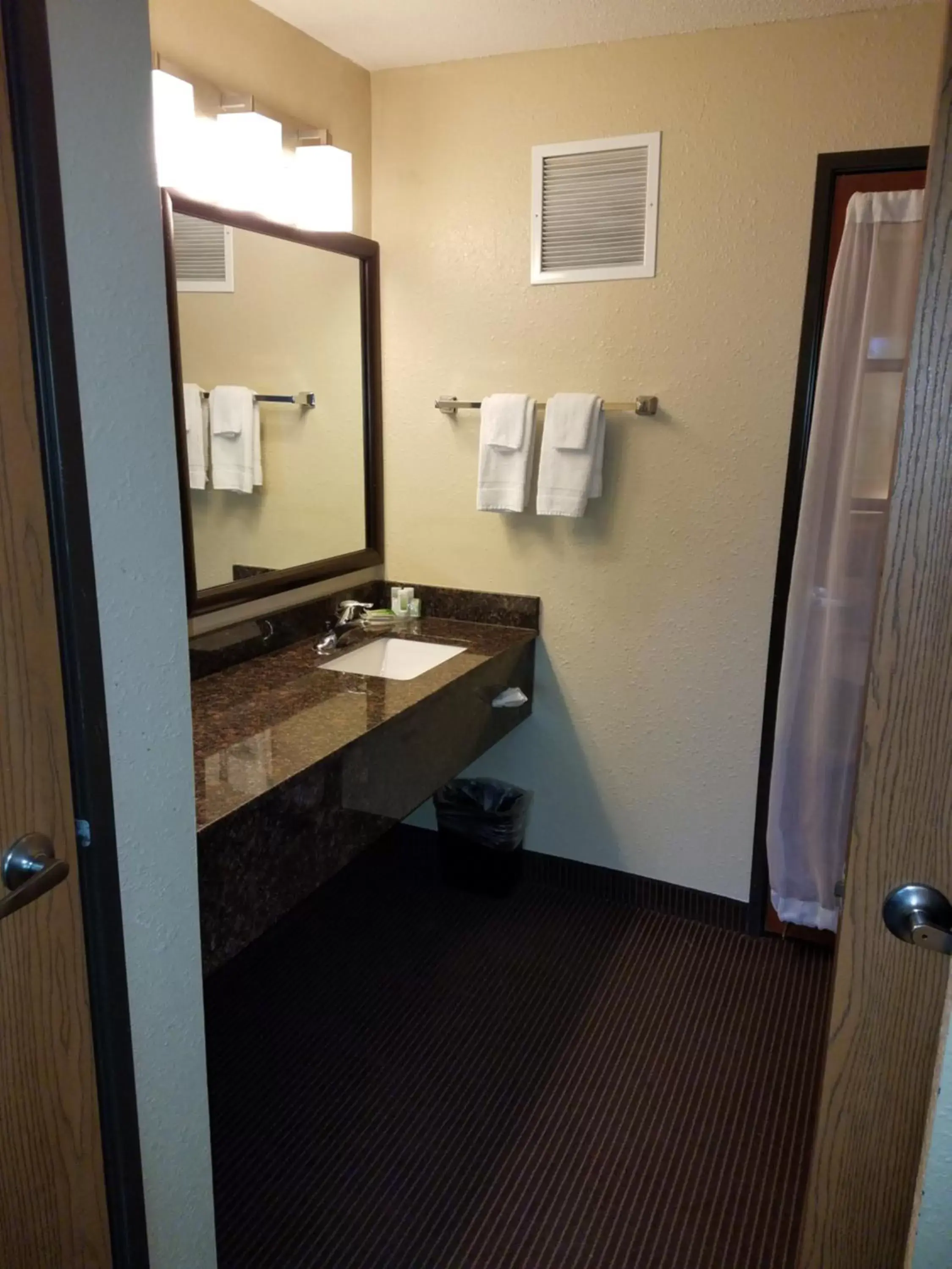 Bathroom in AmericInn by Wyndham Menomonie