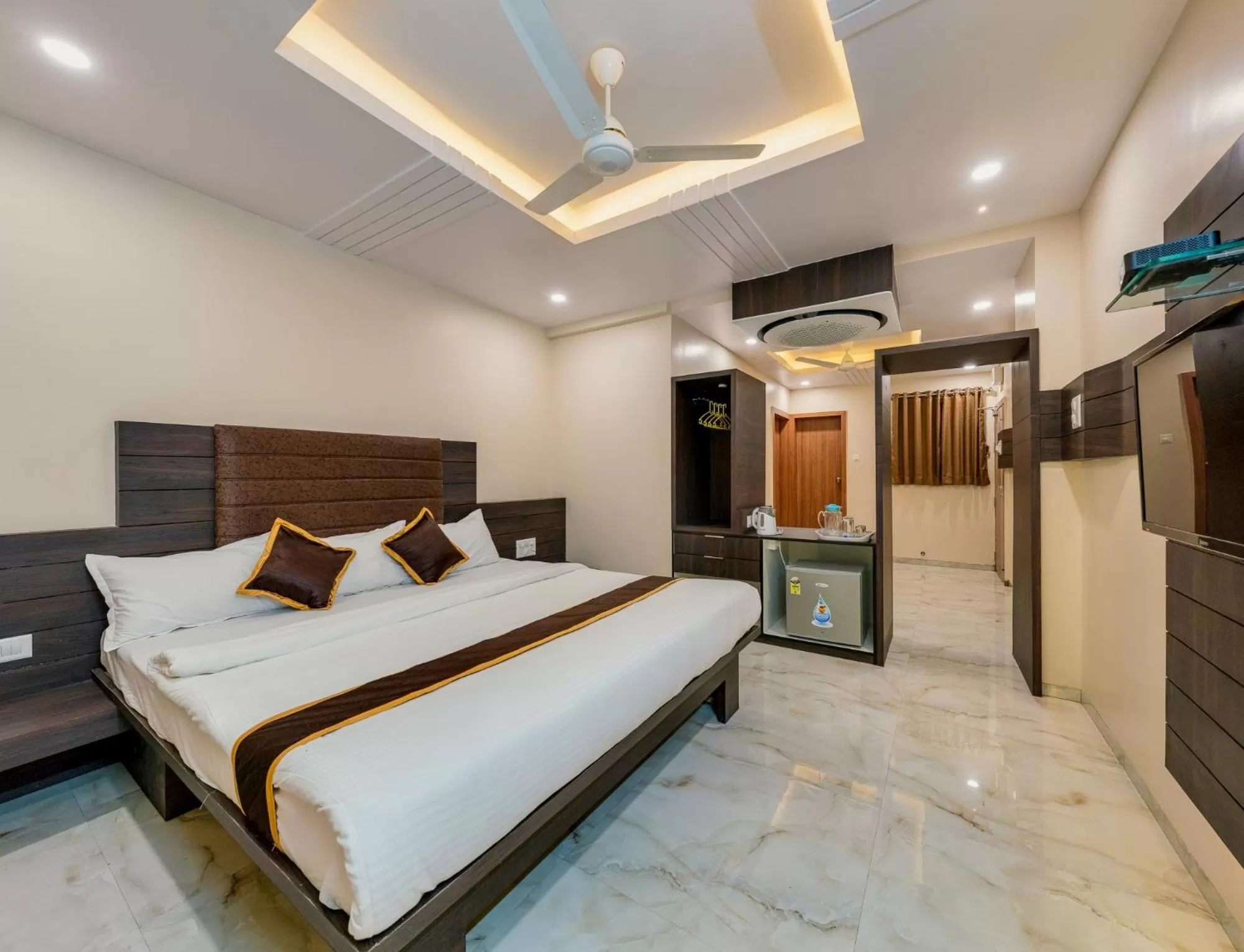 Photo of the whole room, Bed in Hotel Aatithya Satkar Near Mahalaxmi Temple