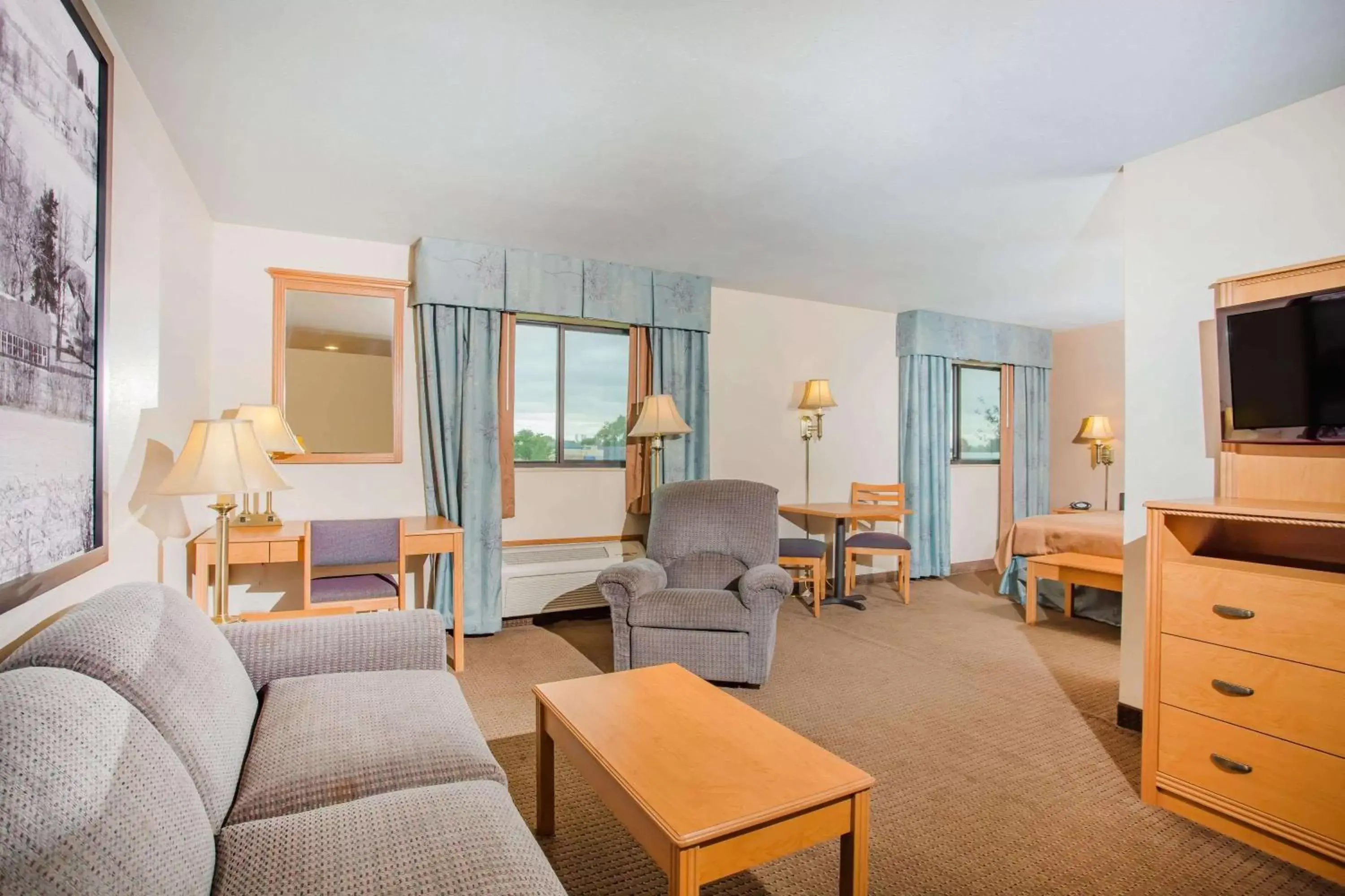 Photo of the whole room, Seating Area in Super 8 by Wyndham Monroe WI