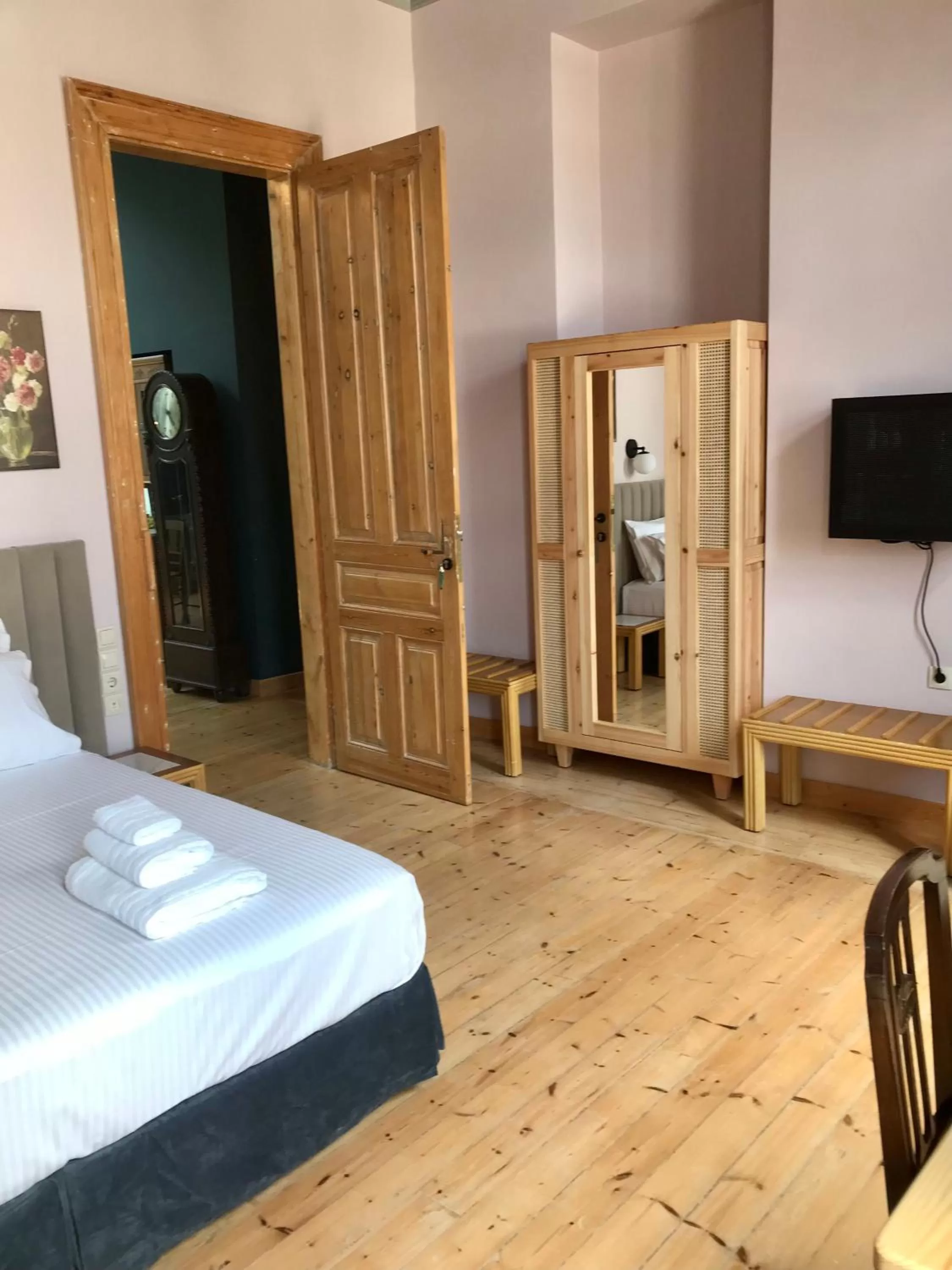 Photo of the whole room, Bed in VASILIKON Hotel 1888 the past is present HISTORICAL PRESERVATION MONUMENT