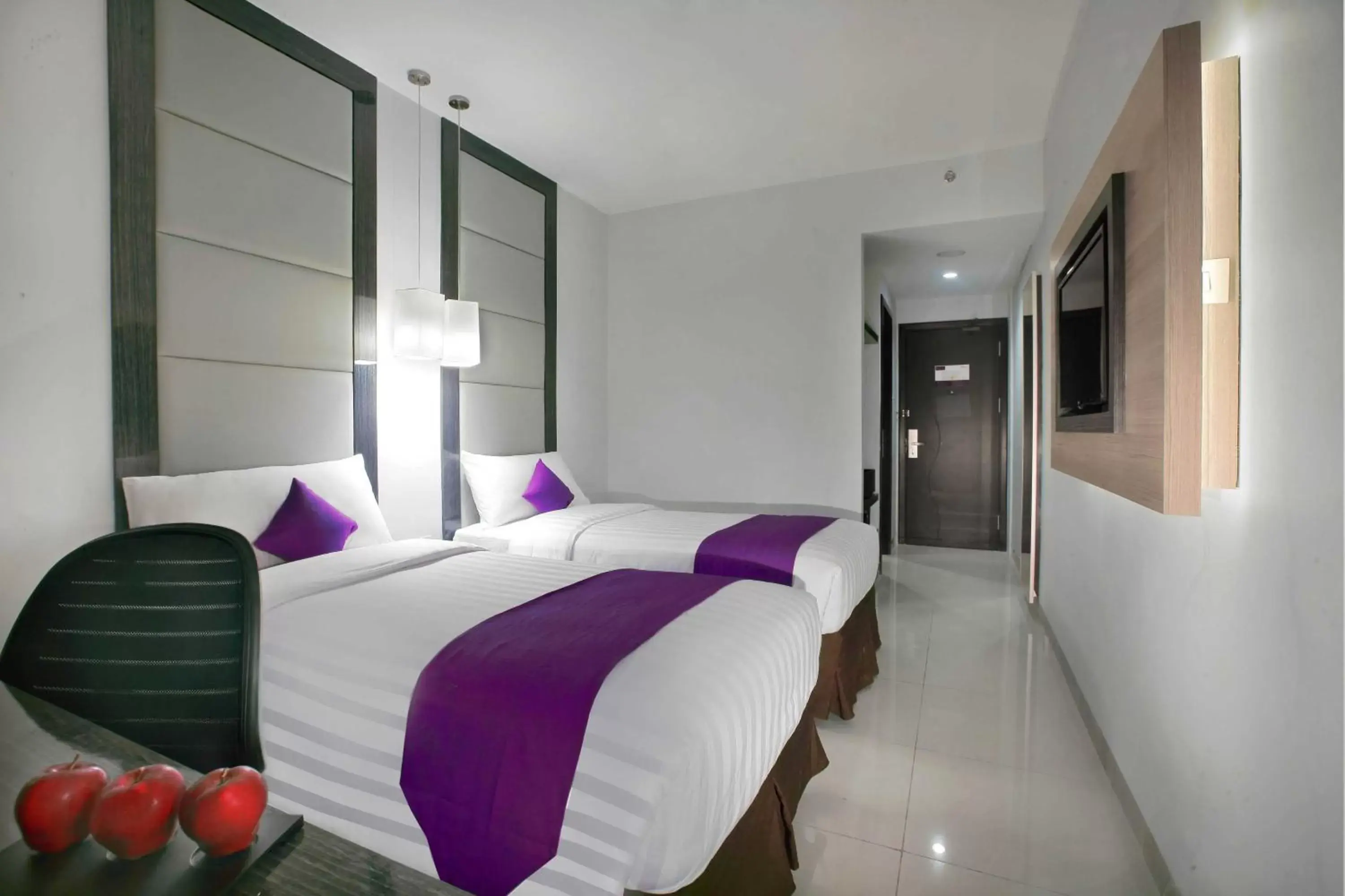 Bed in Quest Hotel Balikpapan by ASTON Bed in Quest Hotel Balikpapan by ASTON
