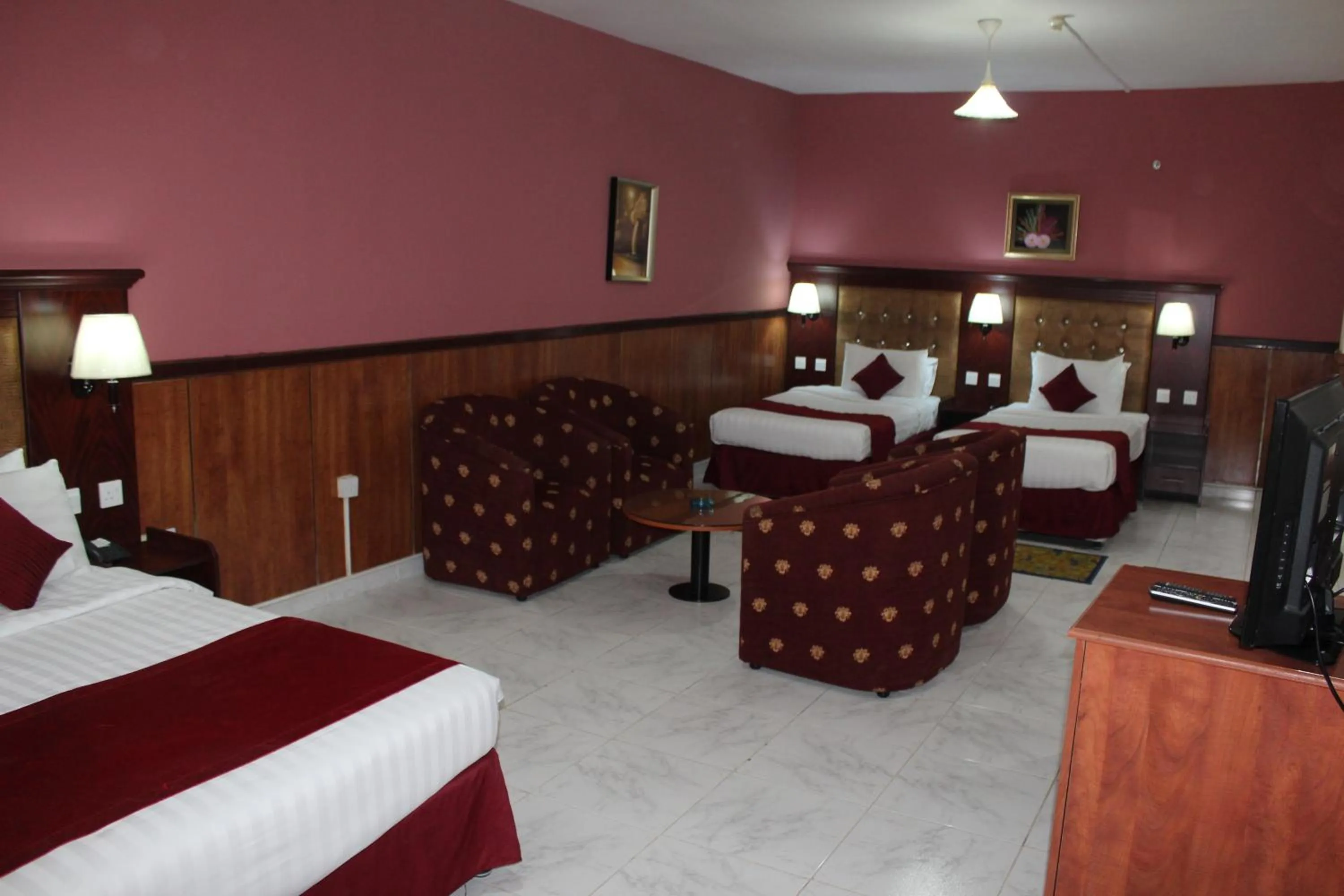 Bed in Grand Nova Hotel