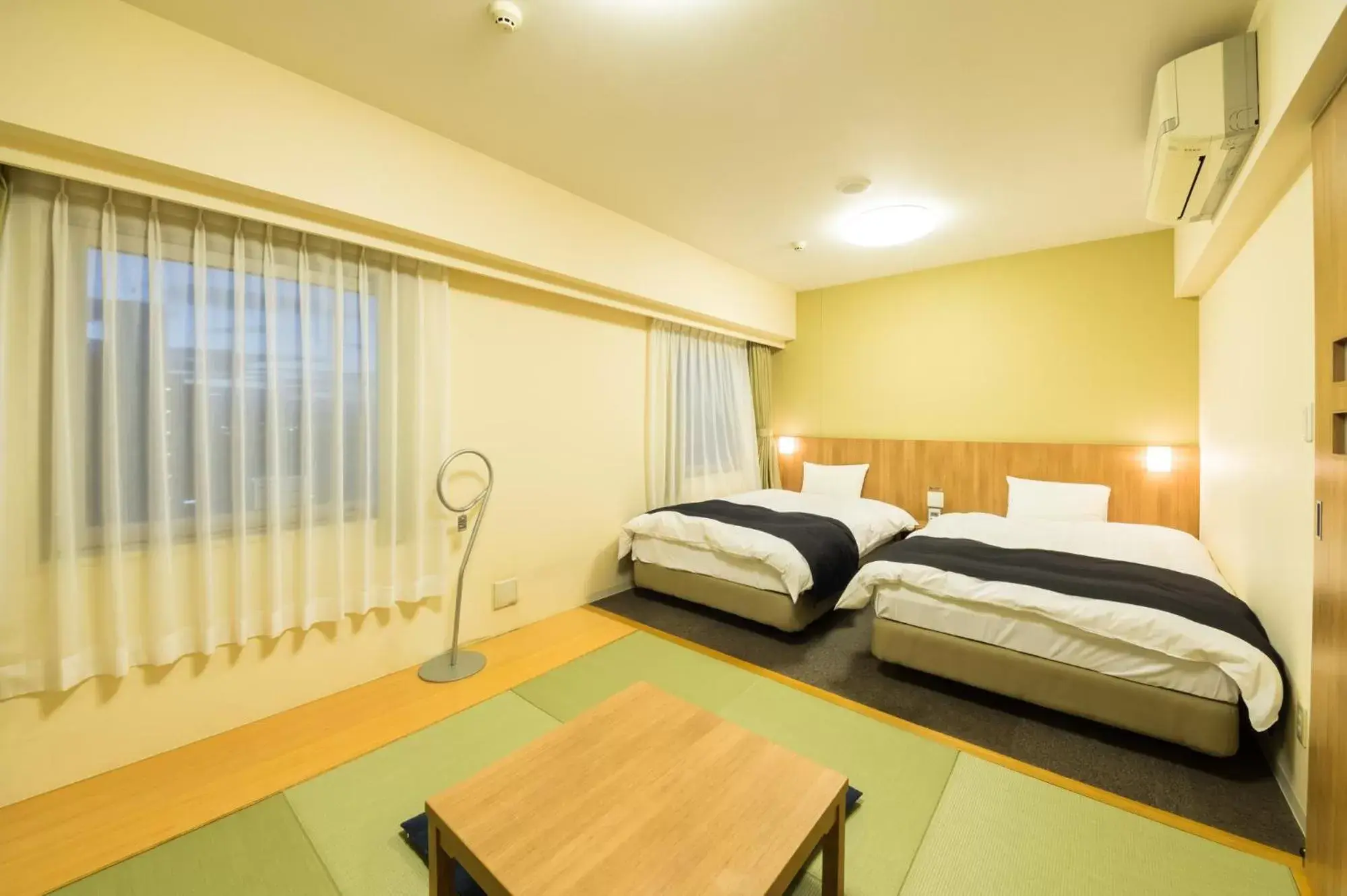 Bed in Dormy Inn Express Mikawaanjo