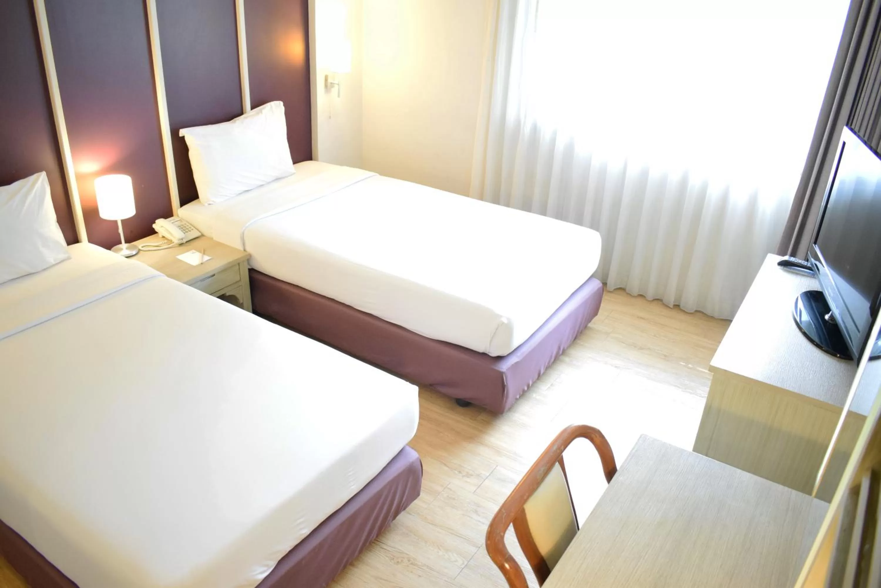 Bed in Trang Hotel Bangkok - SHA Plus
