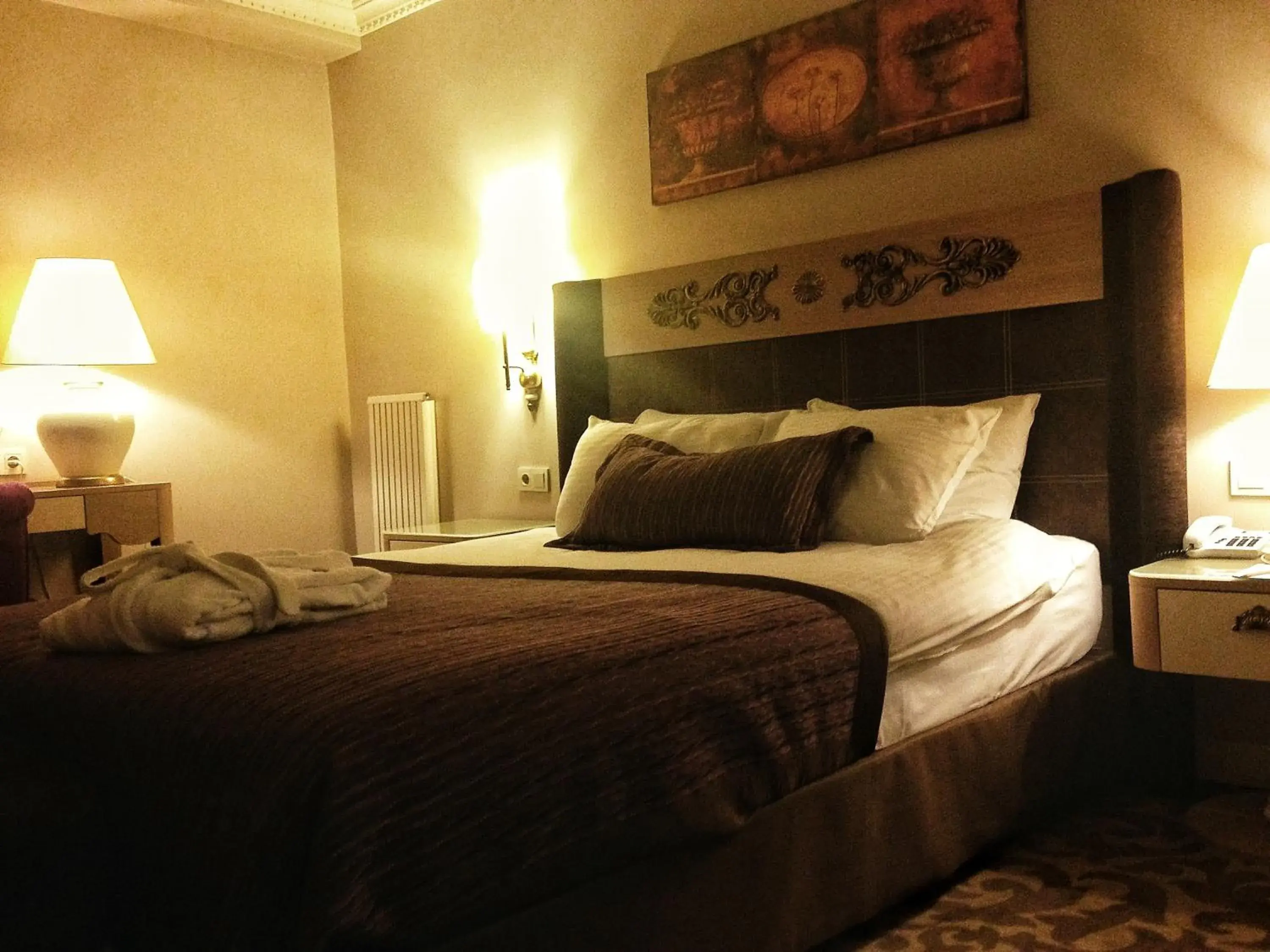 Bed in Sonno Boutique Rooms & Suites