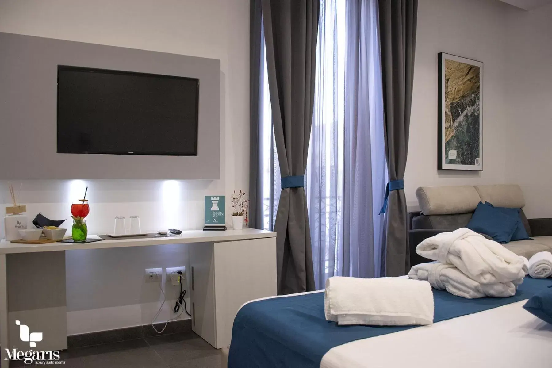TV and multimedia, TV/Entertainment Center in Megaris Luxury Suite Rooms