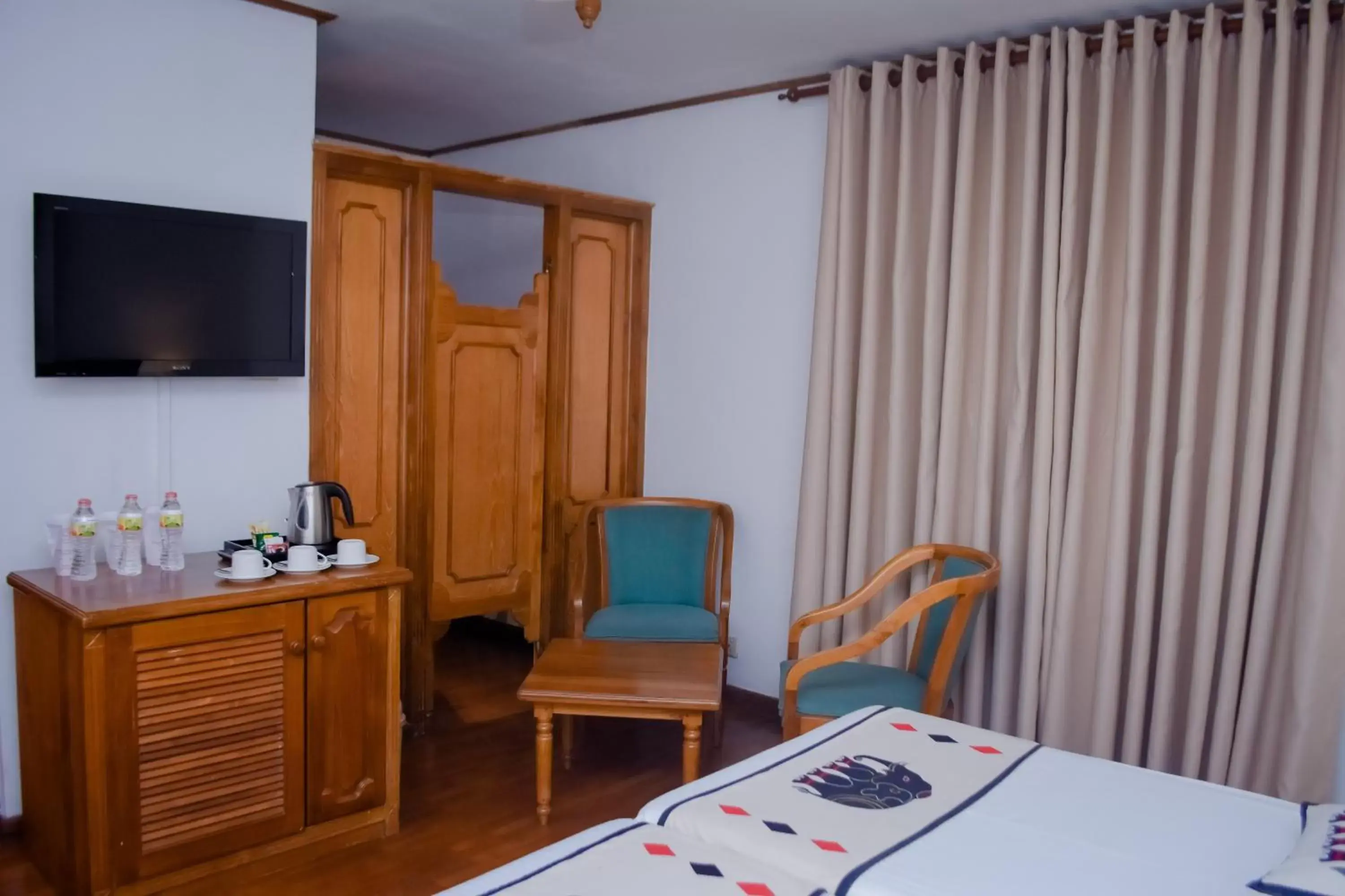 Bed, TV/Entertainment Center in Hotel Casamara