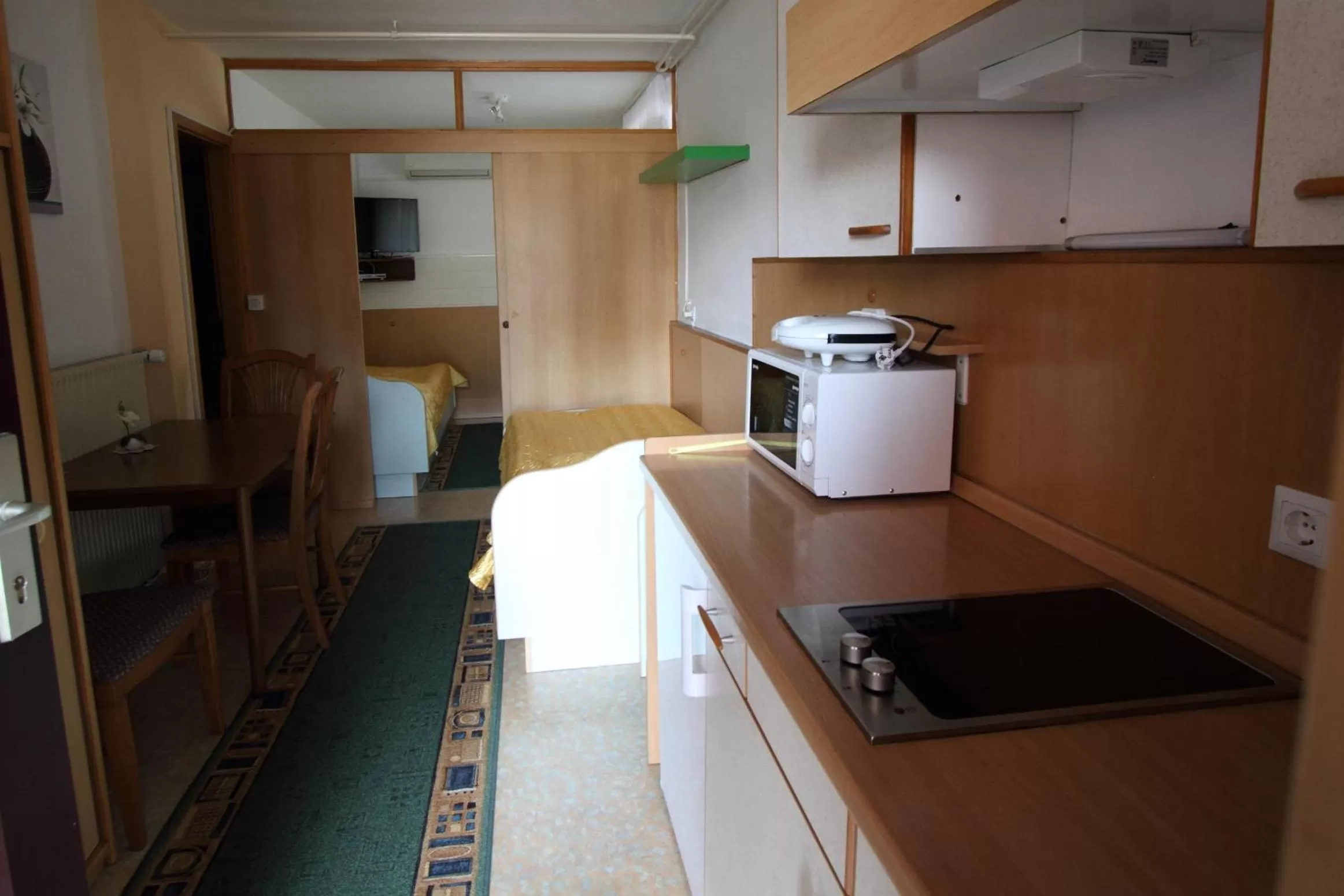 Kitchen or kitchenette in Rooms & Apartments Jana