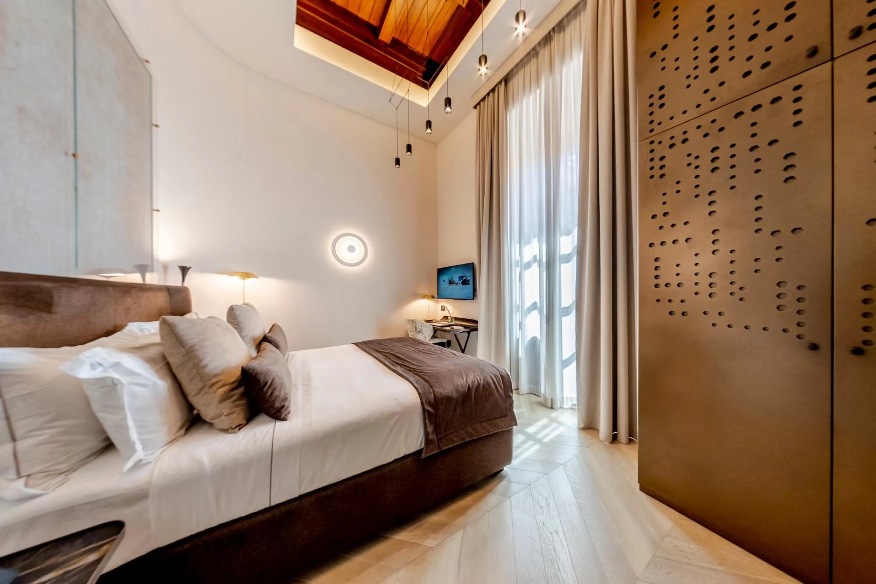 Bed in Martius Private Suites Hotel