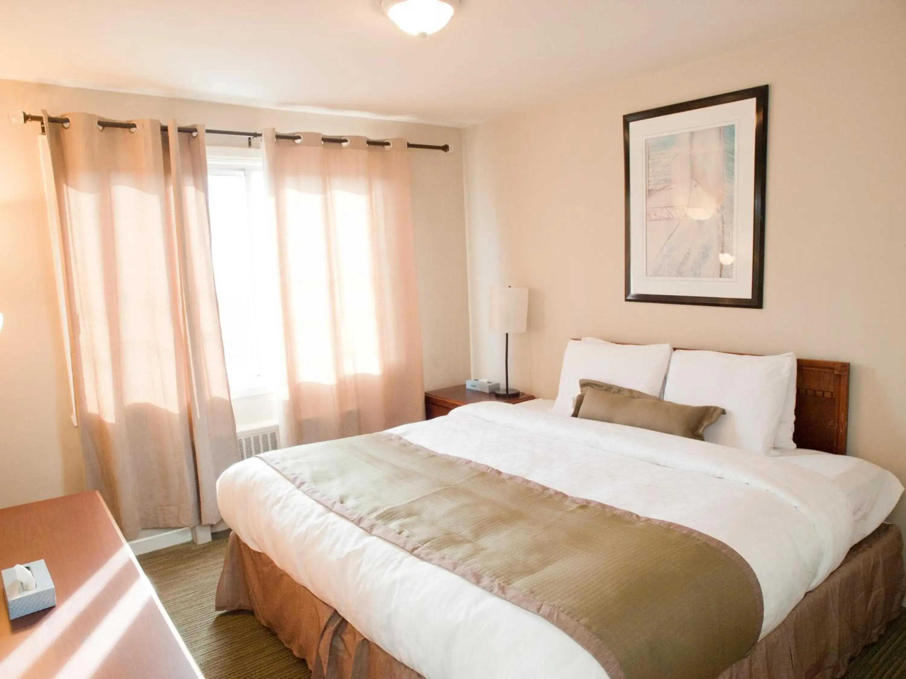 Bed in Beausejour Hotel Apartments/Hotel Dorval