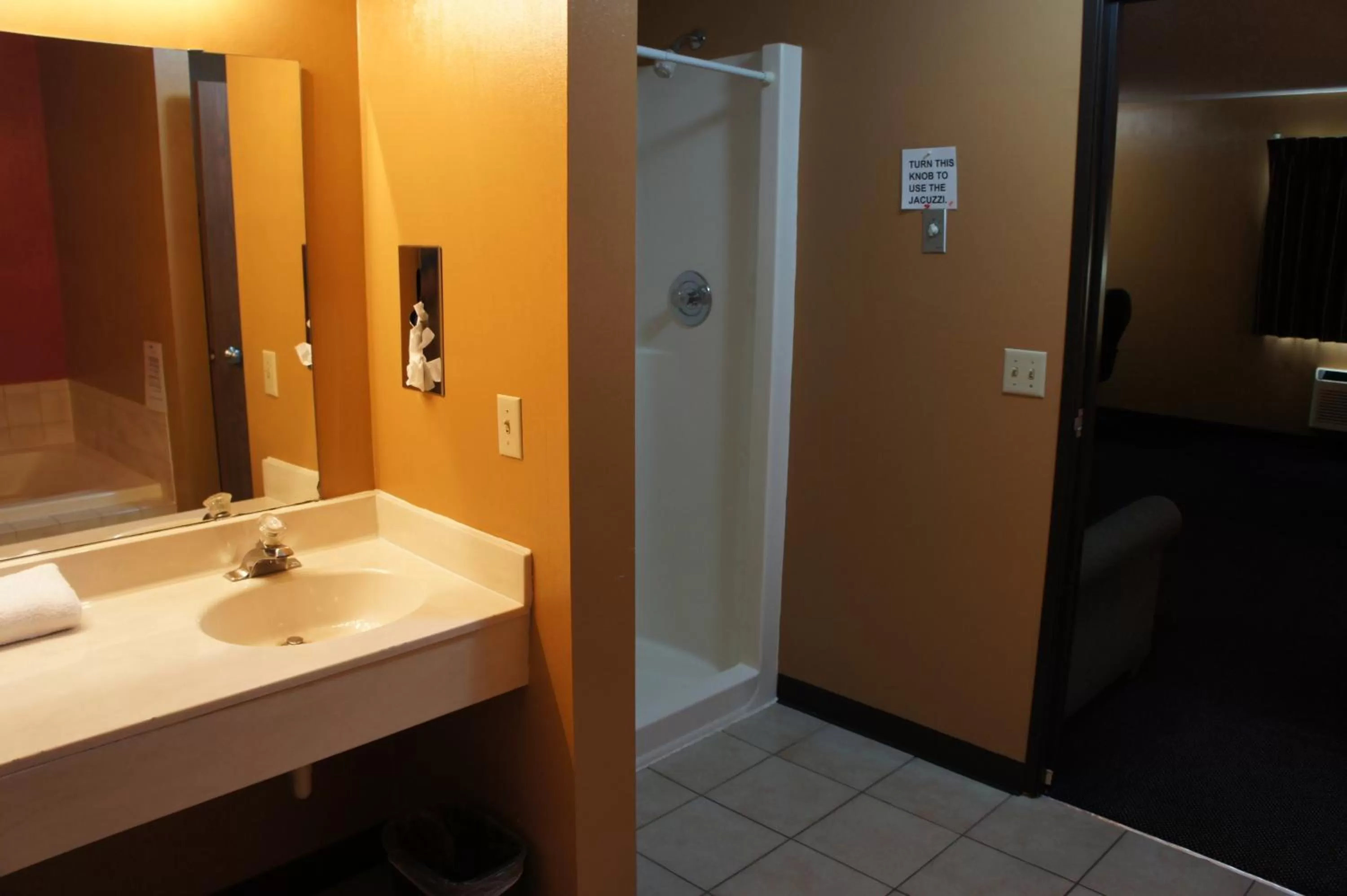 Bathroom in Coratel Inn and Suites Maple Grove
