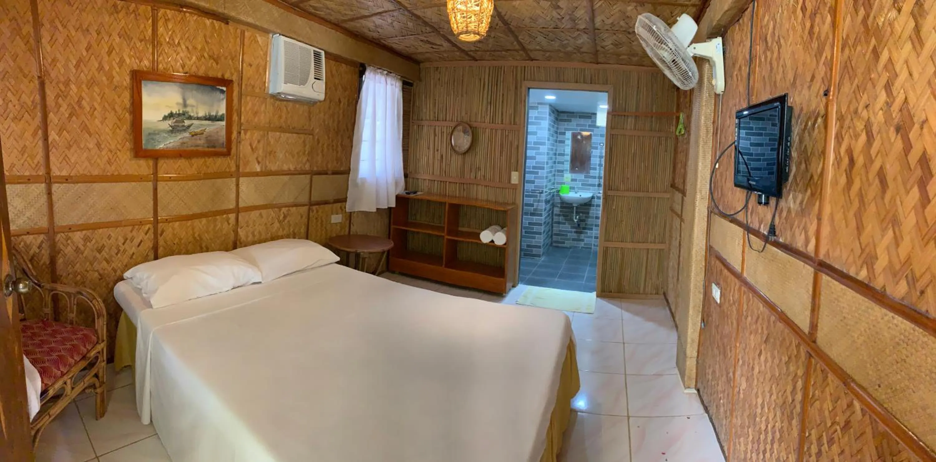 Bed in Bamboo House Beach Lodge & Restaurant