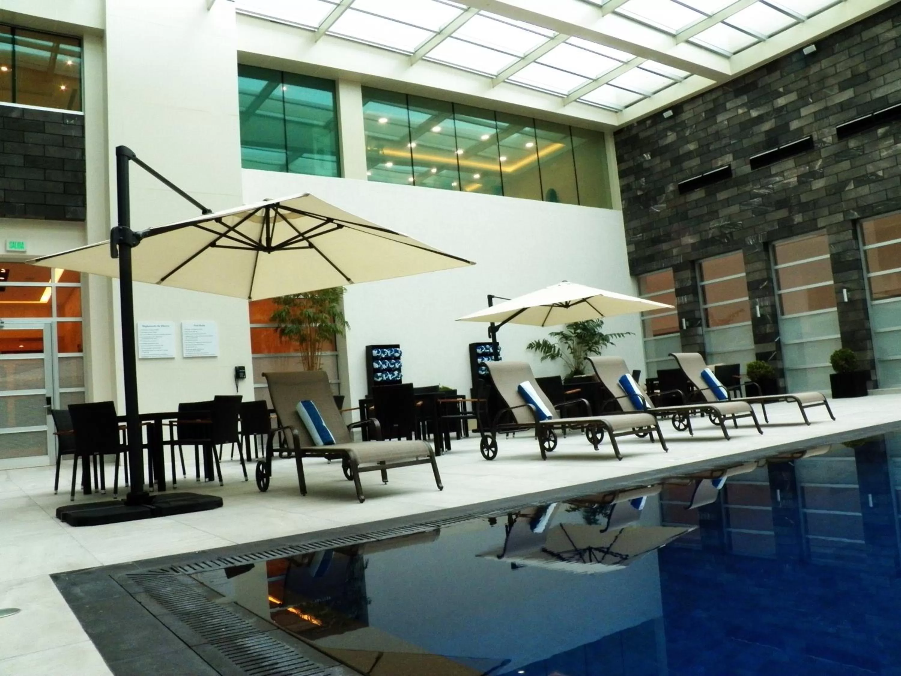 Swimming pool in Holiday Inn & Suites Plaza Mayor by IHG