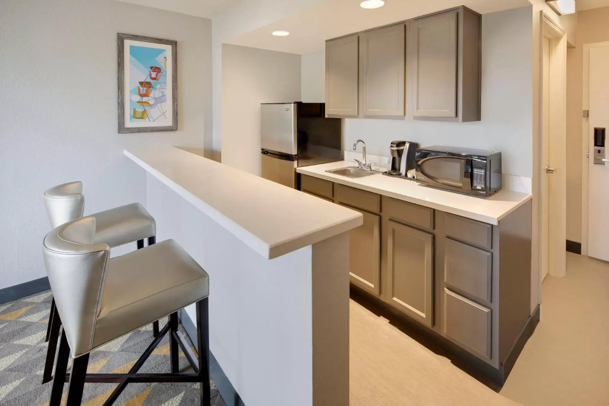 Photo of the whole room, Kitchen/Kitchenette in Holiday Inn & Suites Orlando SW - Celebration Area, an IHG Hotel