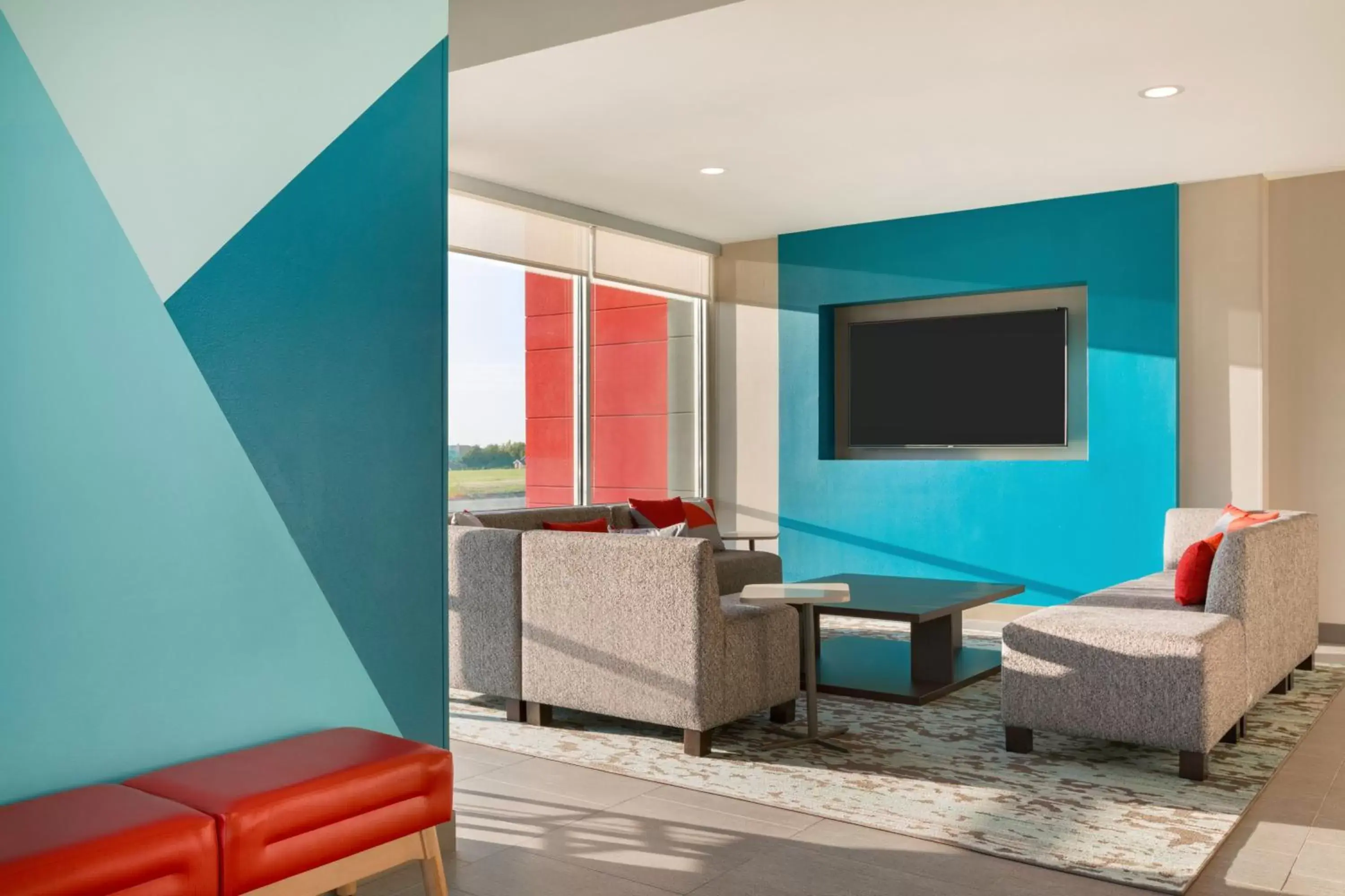 Communal lounge/ TV room, Seating Area in avid hotels - Memphis - Southaven, an IHG Hotel