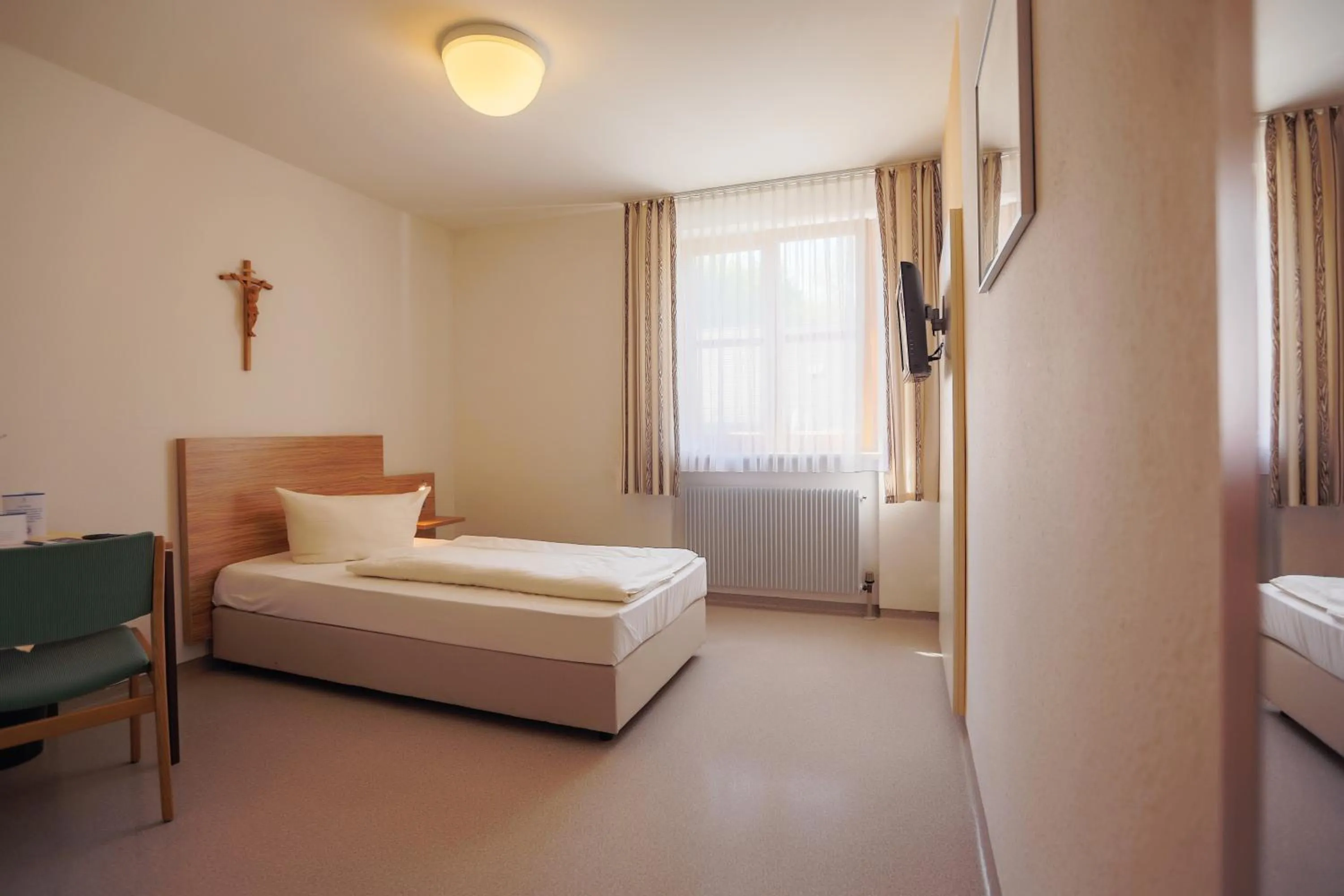 Photo of the whole room, Bed in Kloster St. Josef