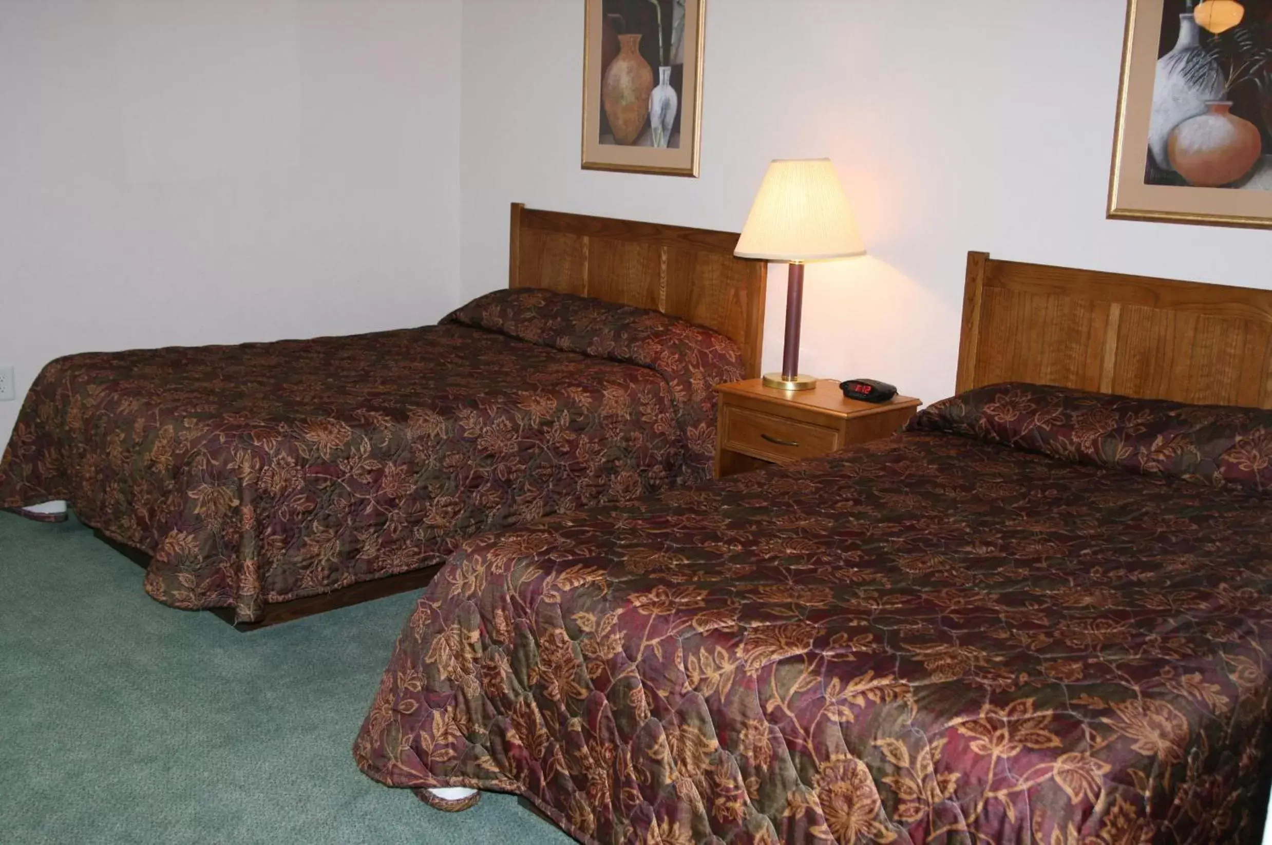 Bedroom, Bed in Affordable Suites Rocky Mount