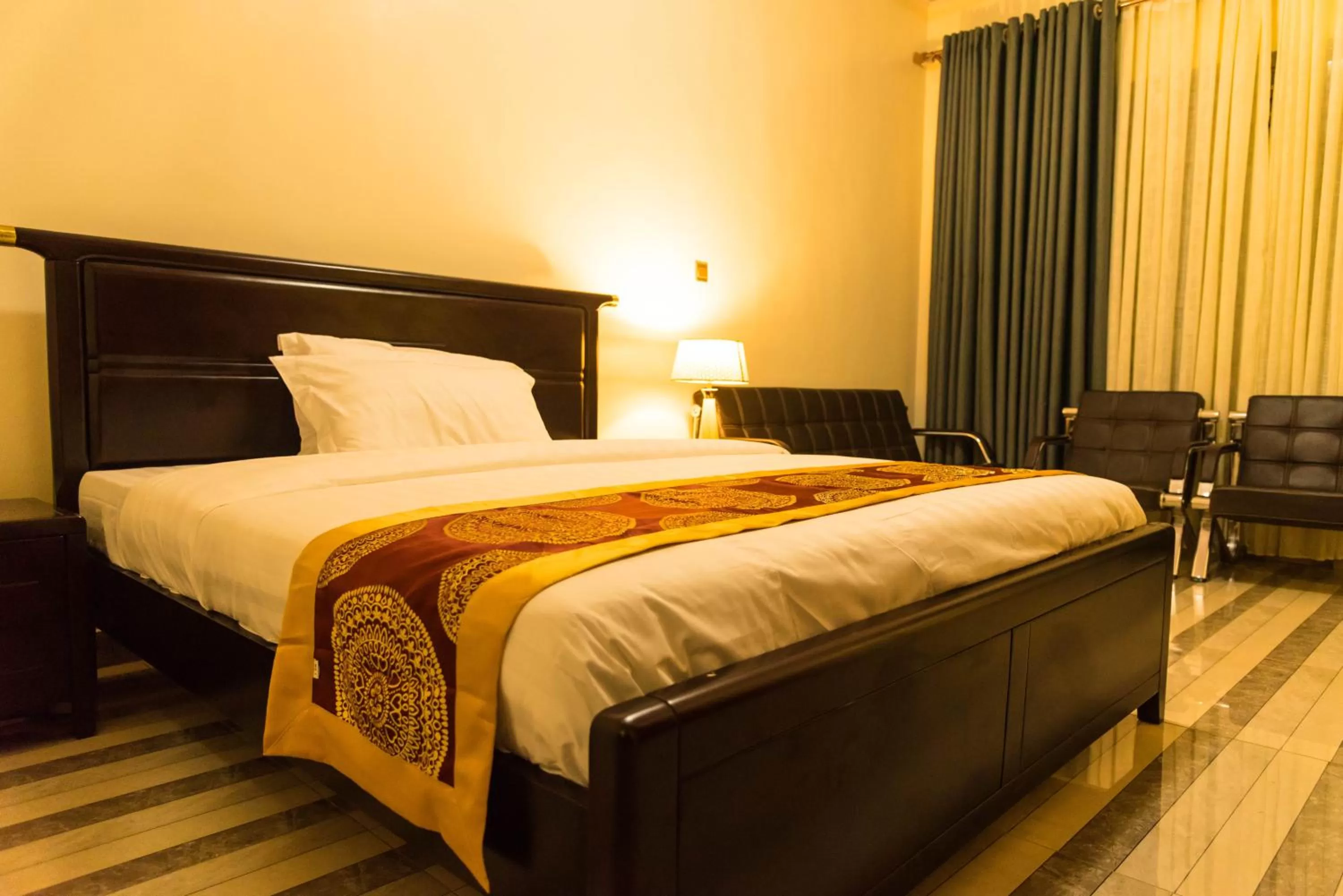 Bed in AVISHA TOWN HOTEL