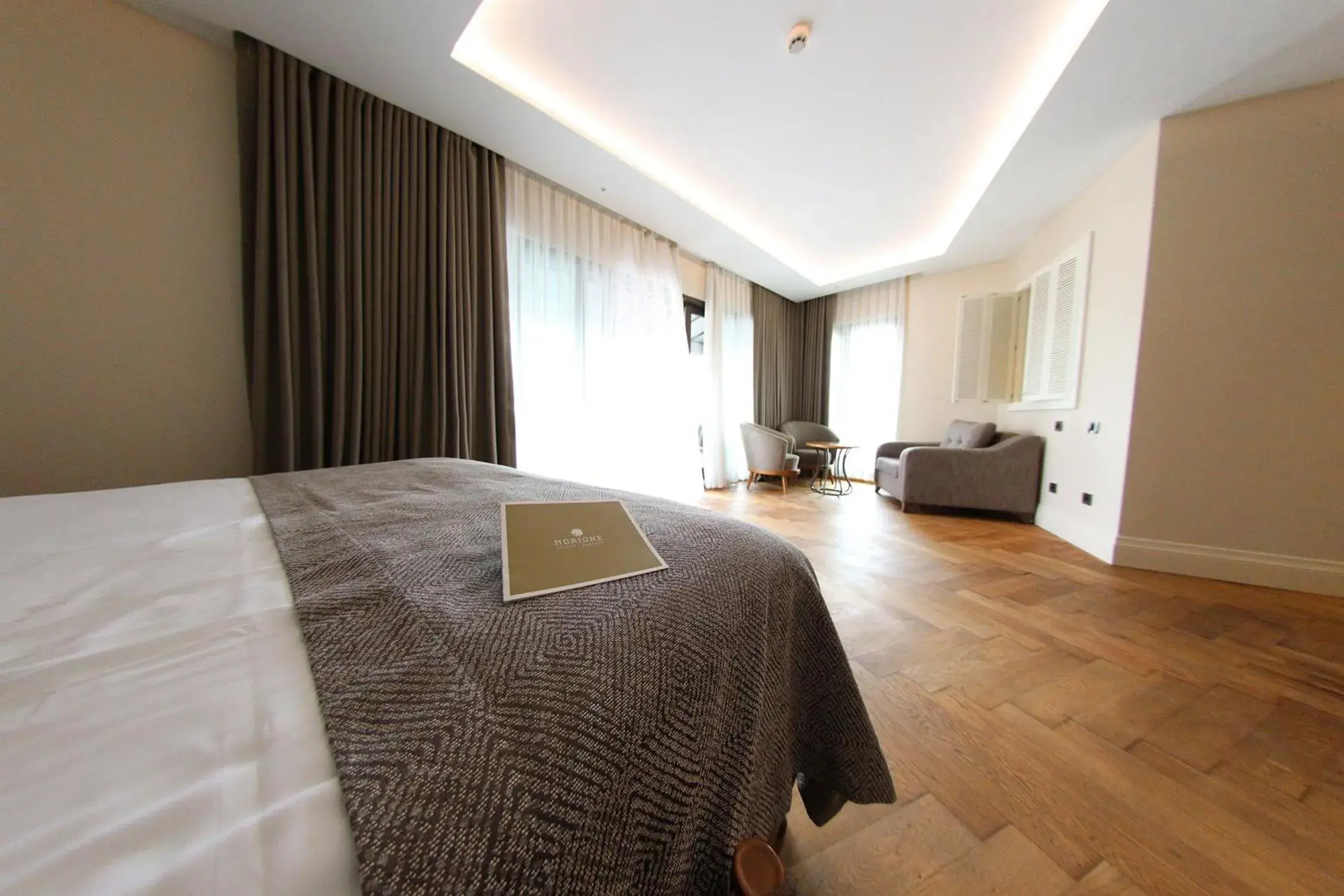 Living room, Bed in Hotel Morione & Spa Center