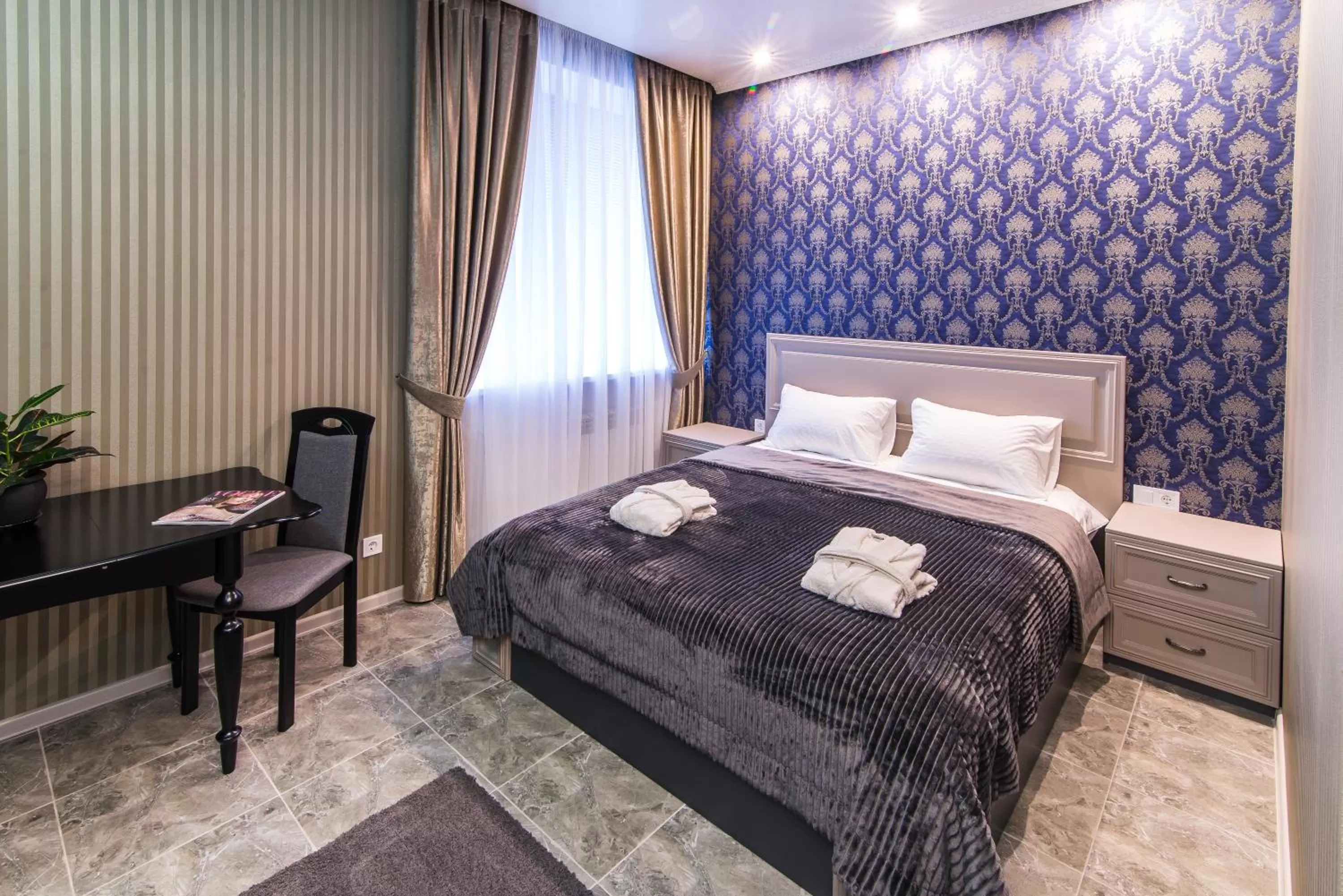 Bed in L.O.Y Family Hotel