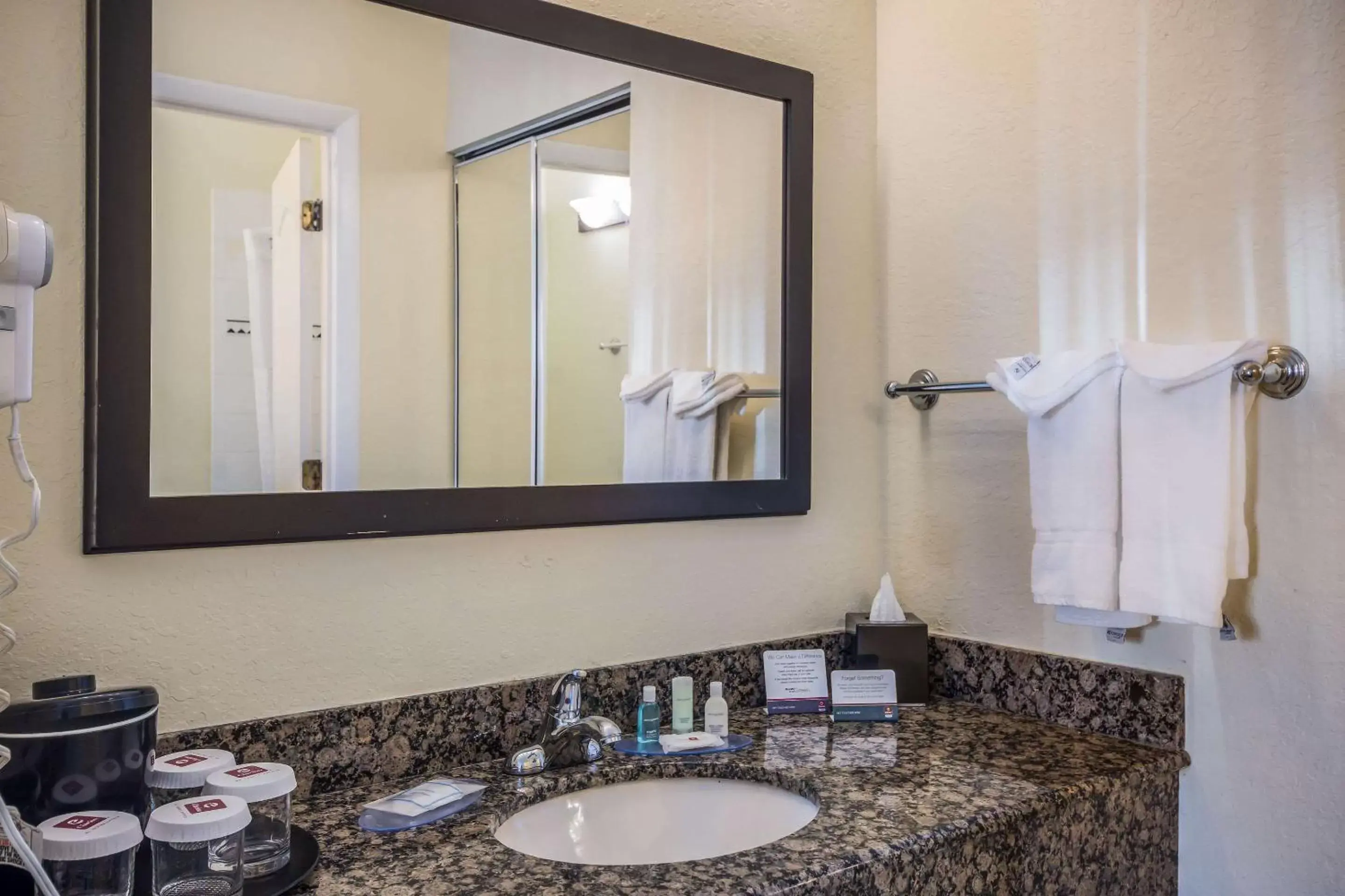 Photo of the whole room, Bathroom in Clarion Inn & Suites Central Clearwater Beach