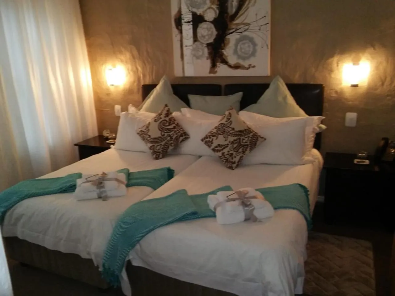 Bed in Point B Guest House -Sustainable Solar Energy