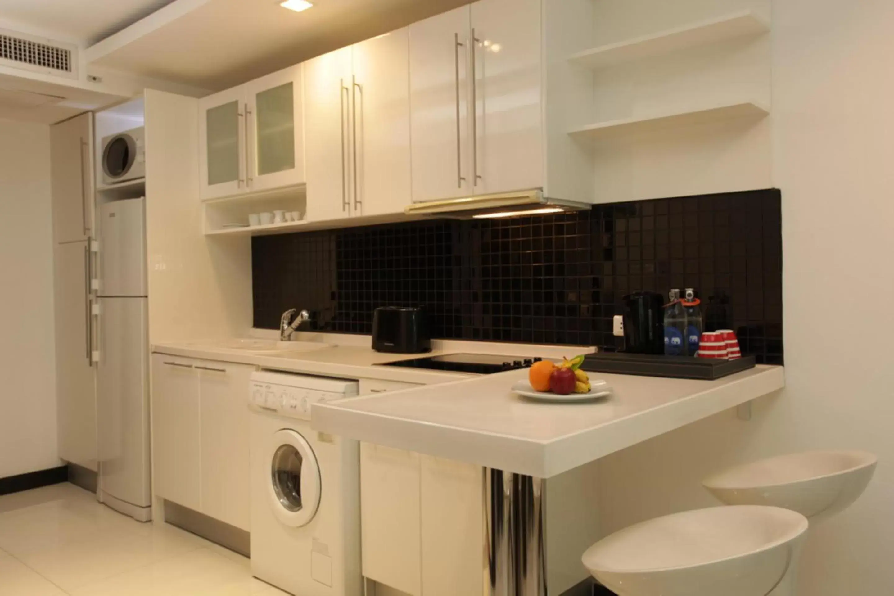 Kitchen or kitchenette in Nova Suites Pattaya by Compass Hospitality