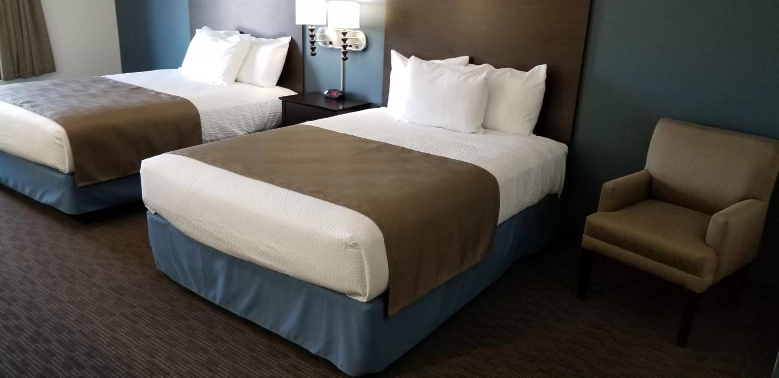 Bed in AmericInn by Wyndham Sioux Falls North