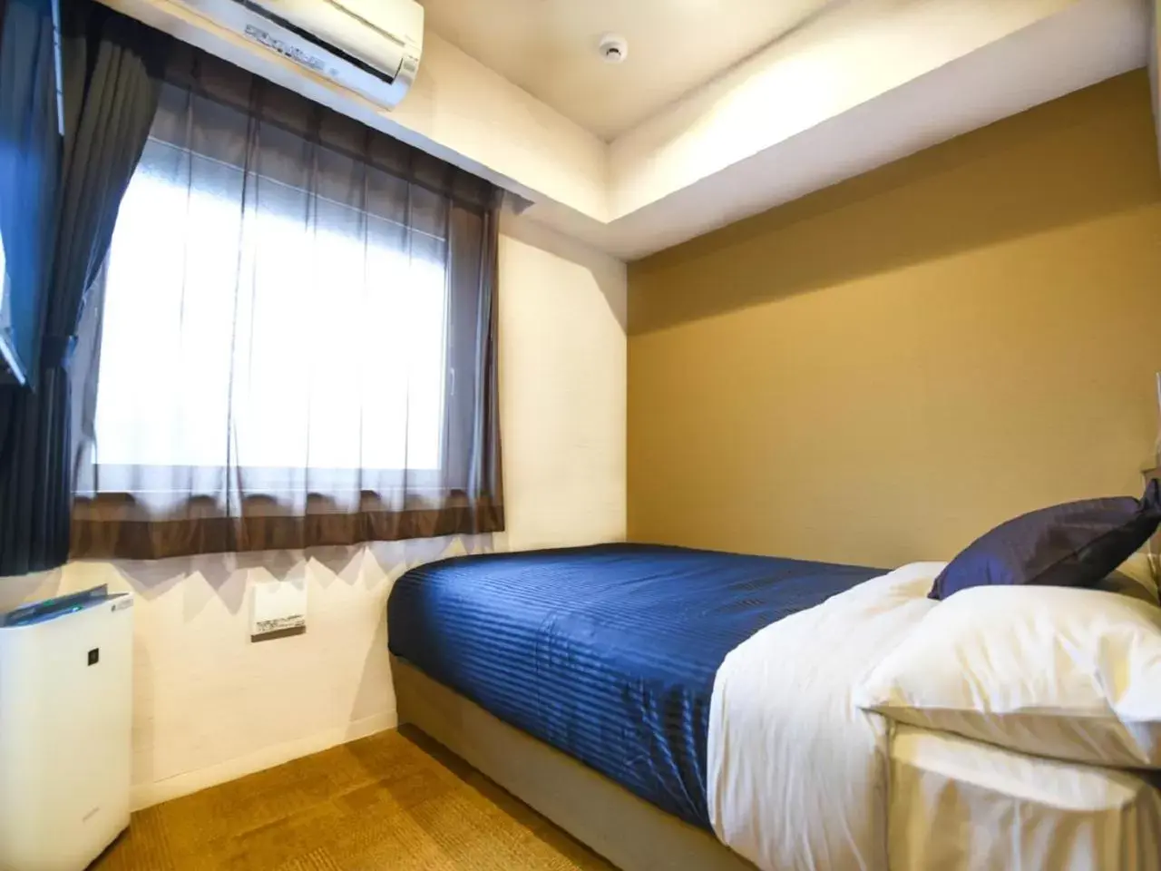 Bed in HOTEL LiVEMAX Fukuoka Tenjin