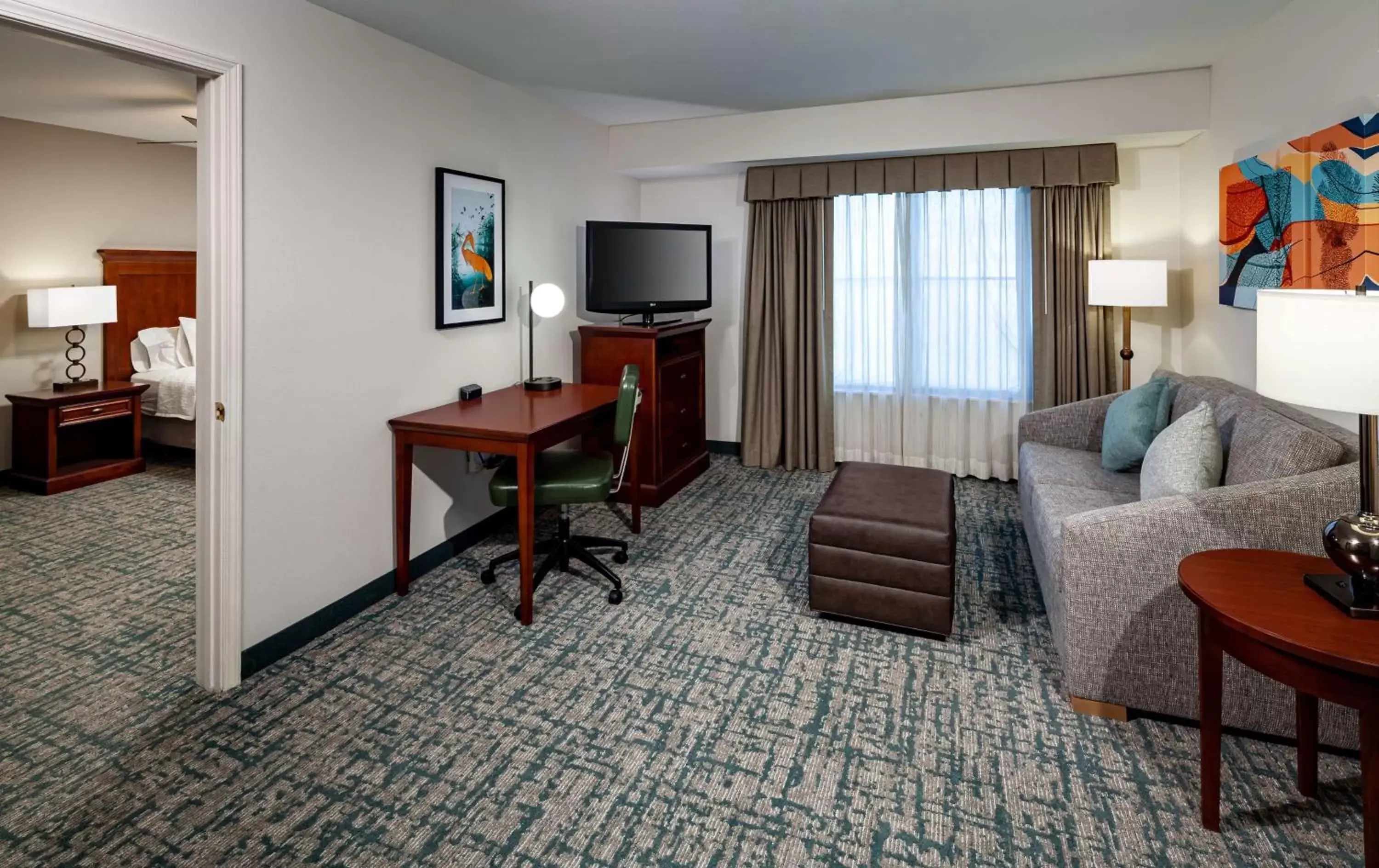 Bedroom, TV/Entertainment Center in Homewood Suites by Hilton Gainesville