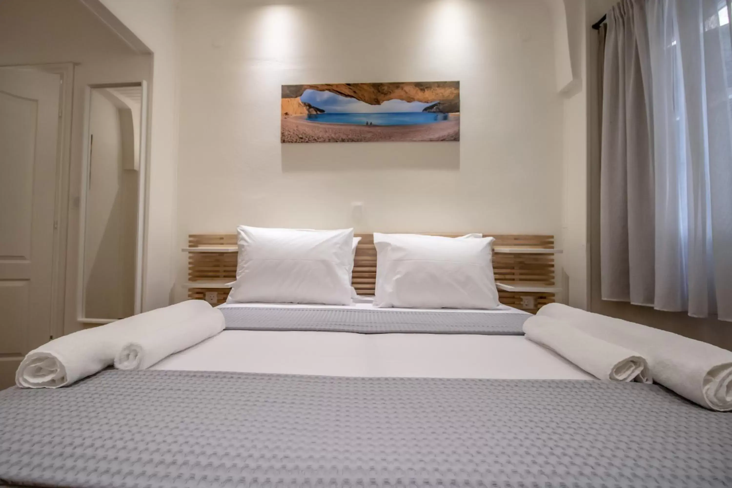 Bed in Levkosh Apartments at Lefkada's Heart