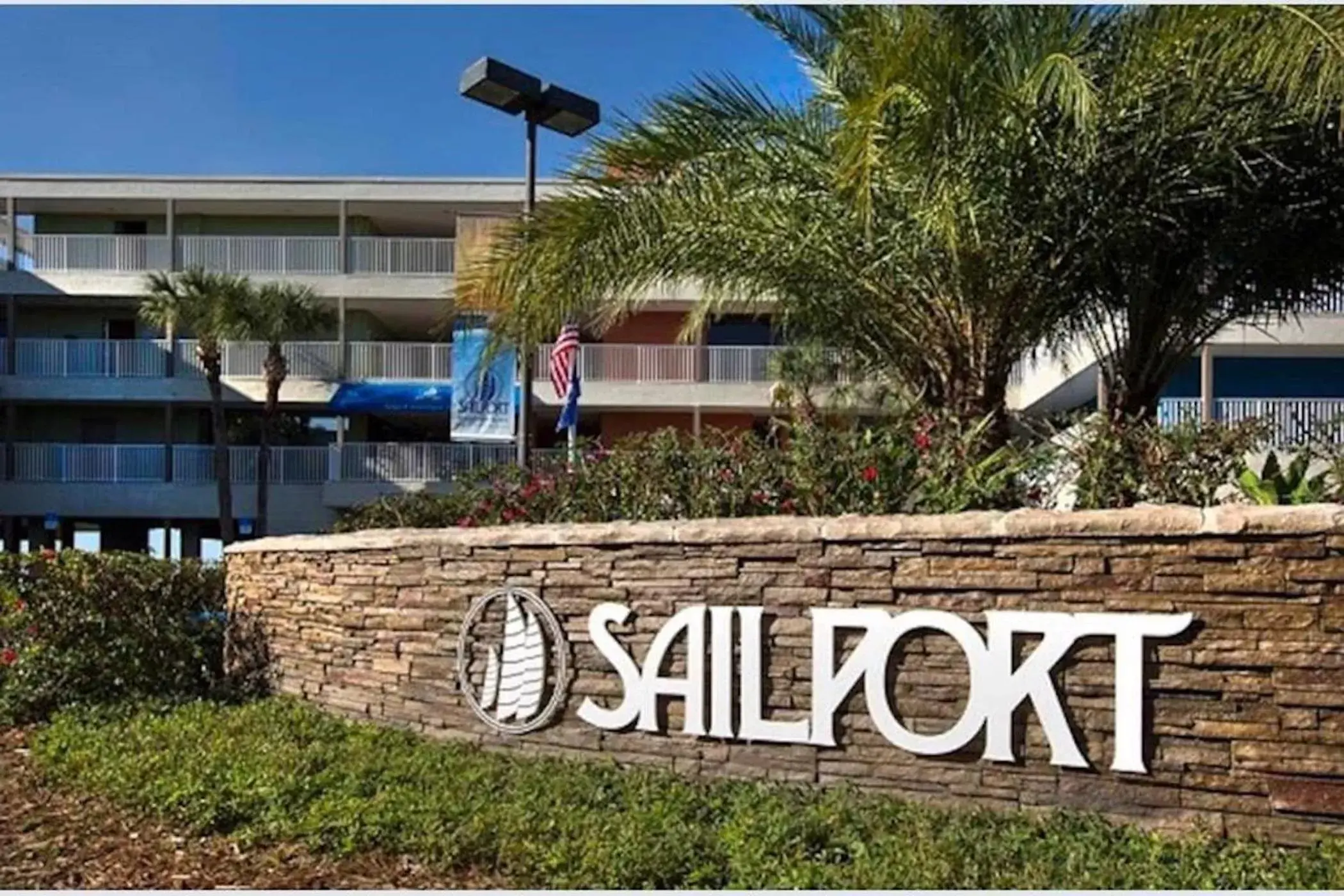 Property Building in 2 Bed Condo with Balcony Facing Pool and Sunsets!